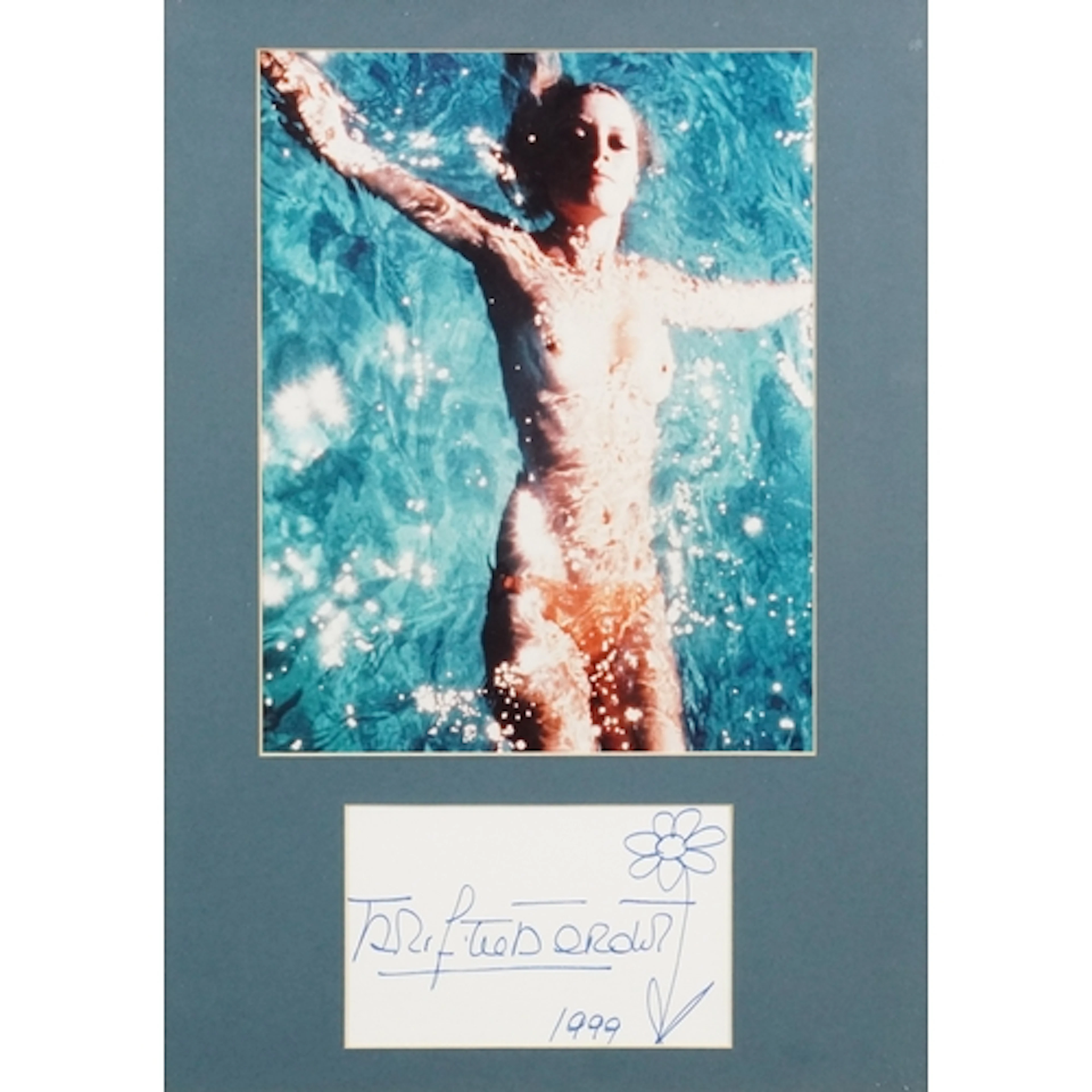 Topless colour photograph of Brigitte Bardot with signature,...