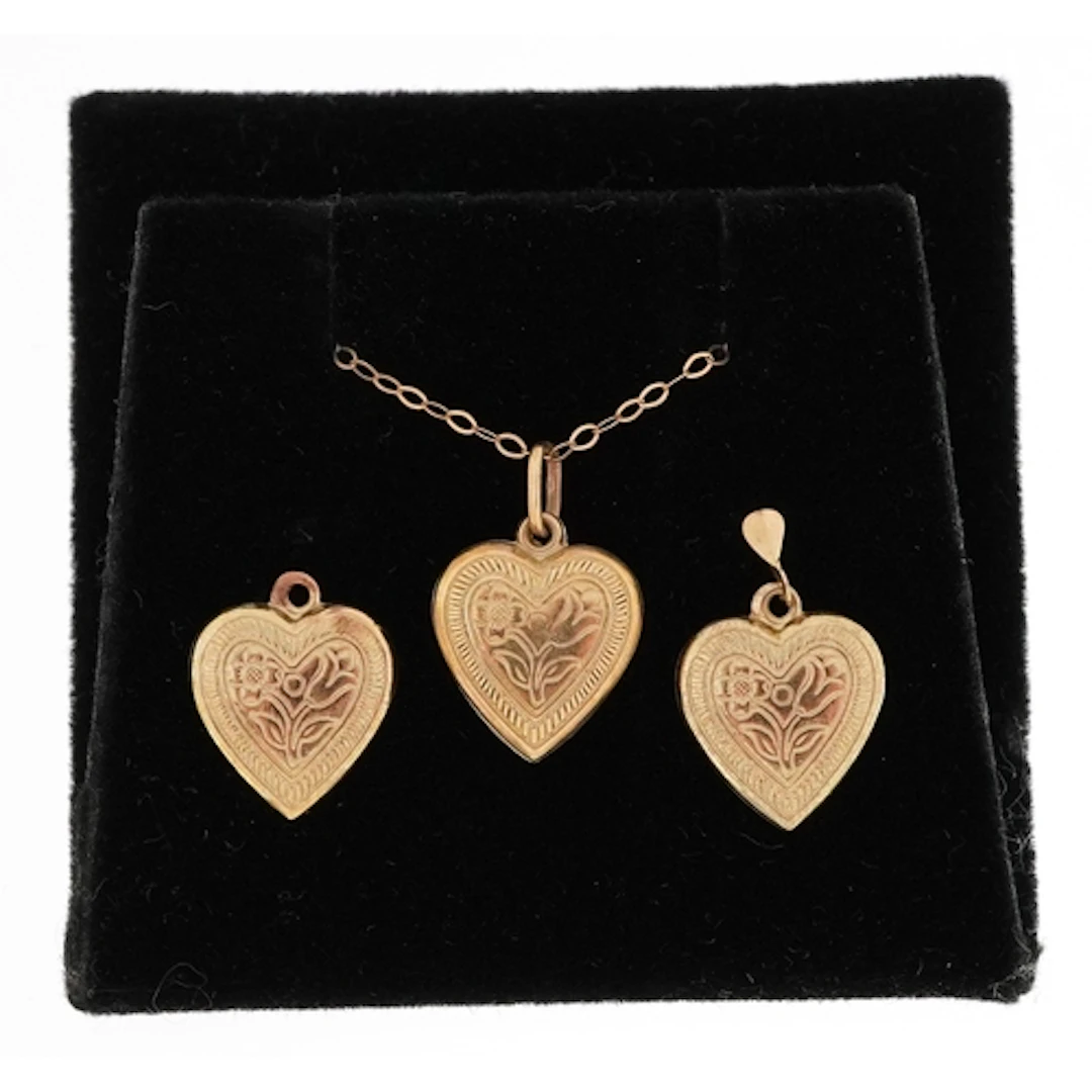 9ct gold love heart pendant on a 9ct gold necklace, 1.3cm hi...