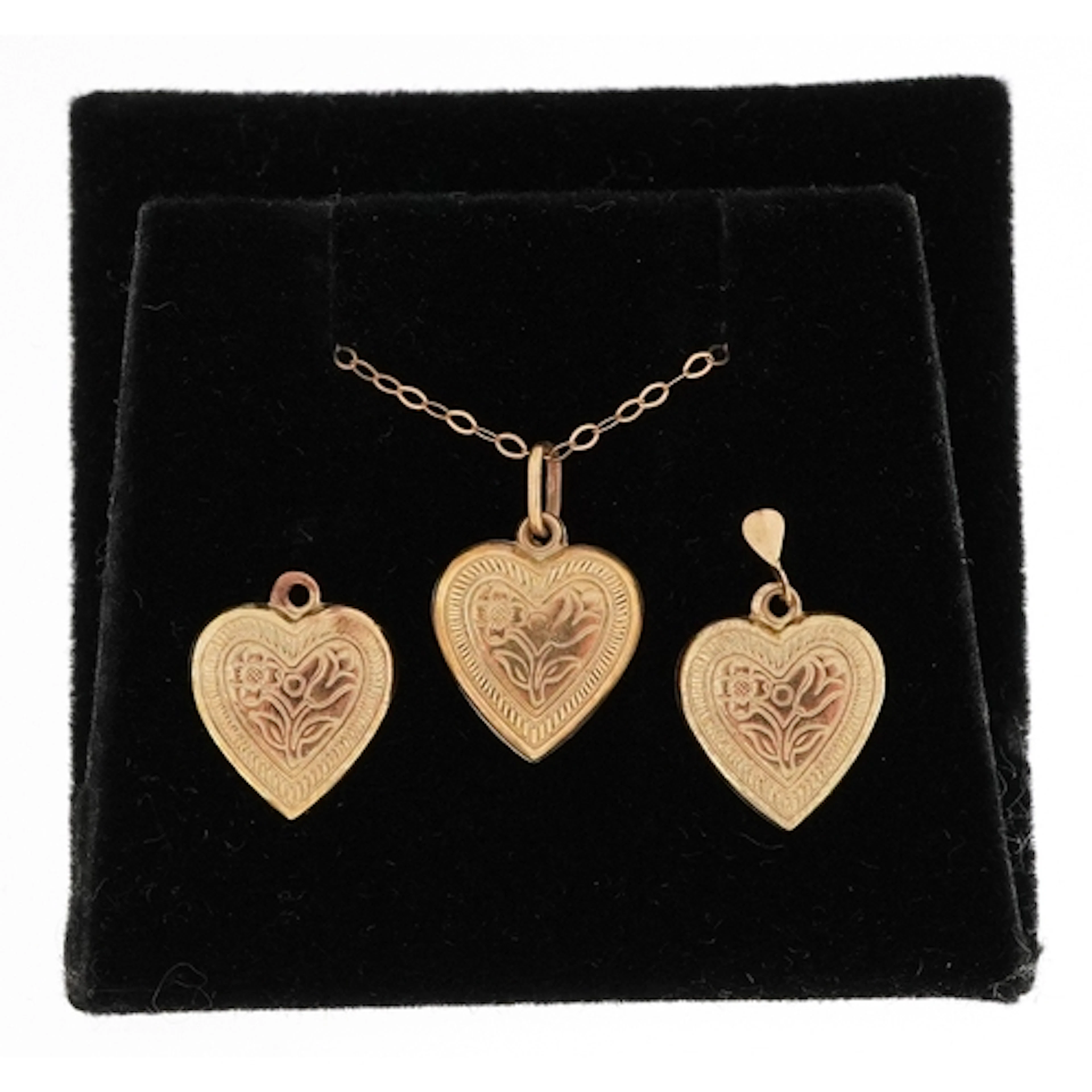 9ct gold love heart pendant on a 9ct gold necklace, 1.3cm hi...