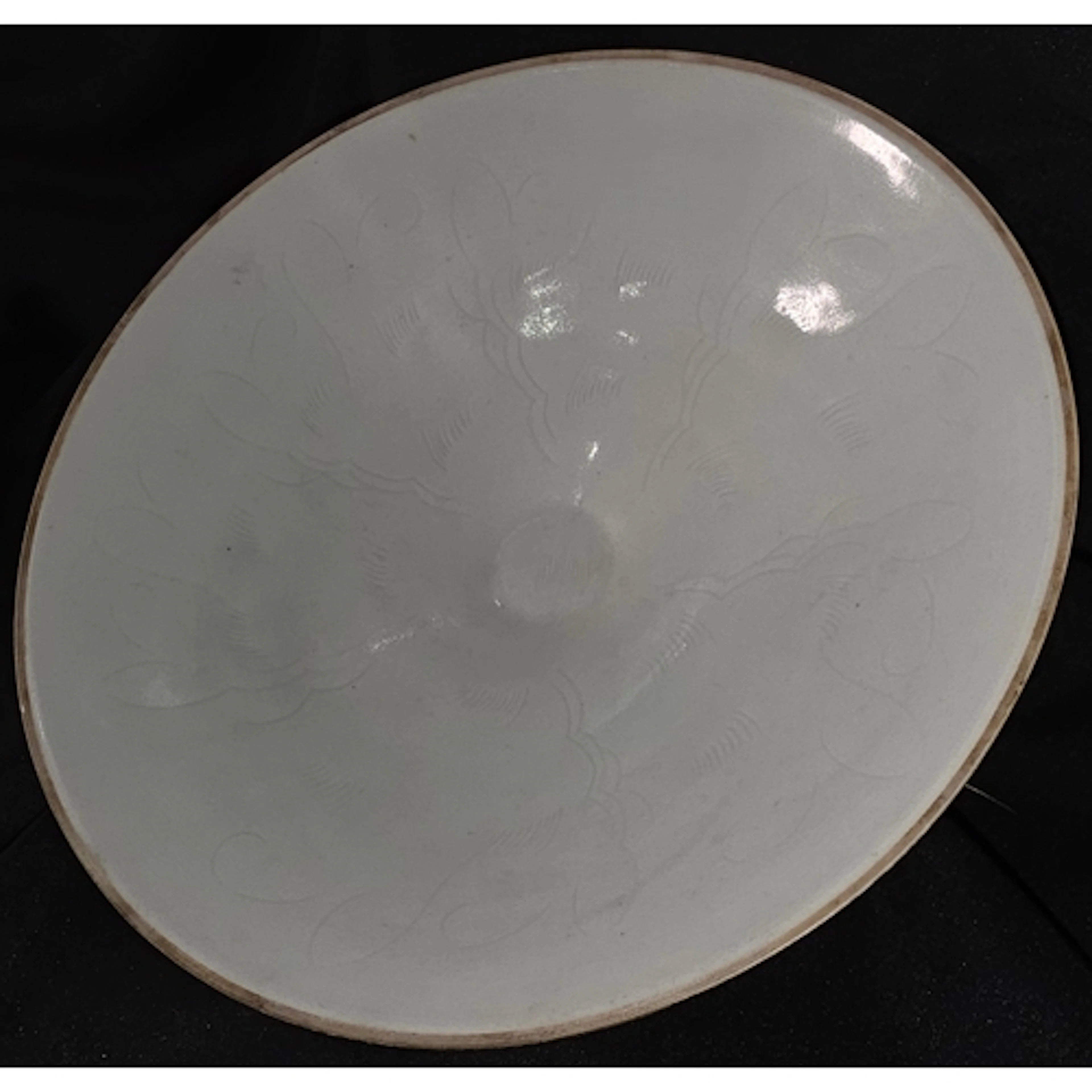 A Chinese fine porcelain celadon bowl with incised decoratio...