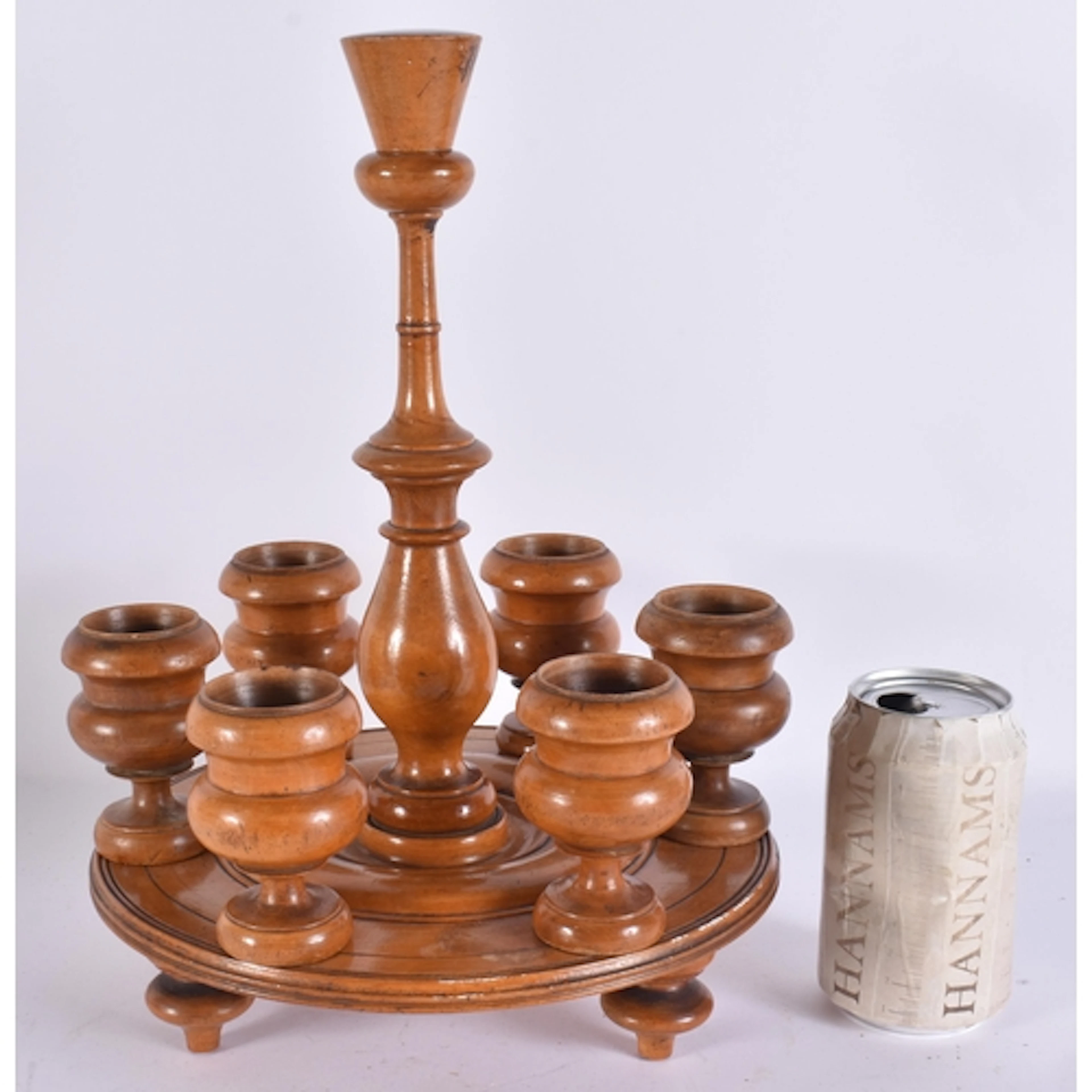 AN ANTIQUE CARVED WOOD EGG CUP STAND. 33 cm x 15 cm.