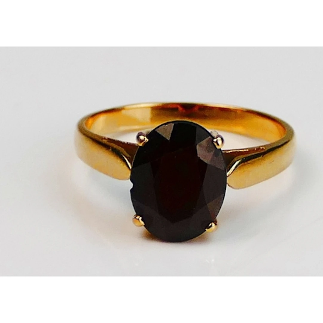 A garnet ring in a 14ct yellow gold setting, 10.3x8mm stone,...