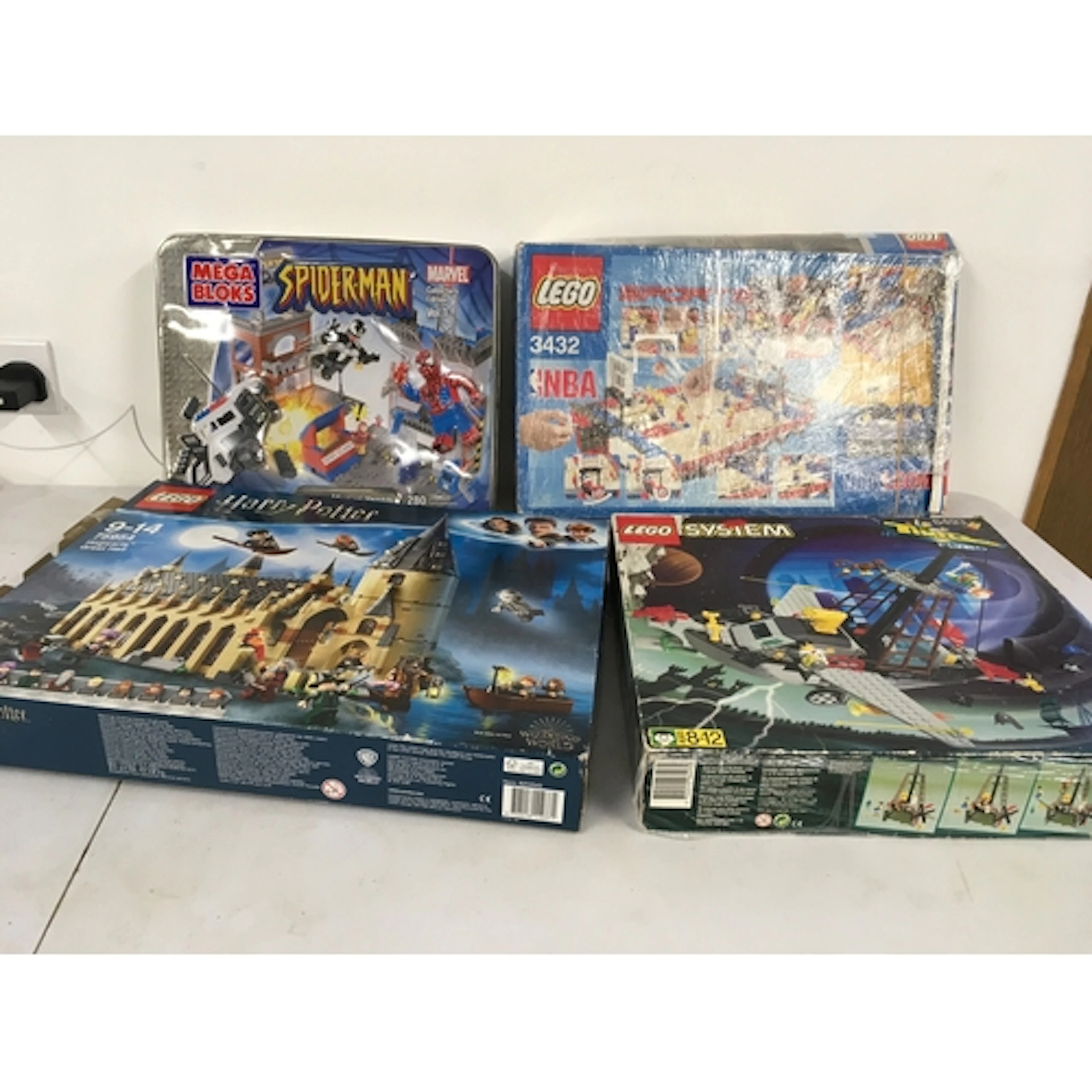A collection of 3 Lego 75954, 6493, 3432 sets and 1 Mega Blo...