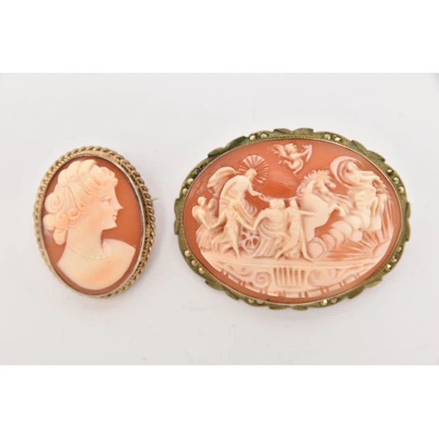 TWO CAMEO BROOCHES, the first a carved shell cameo depicting...