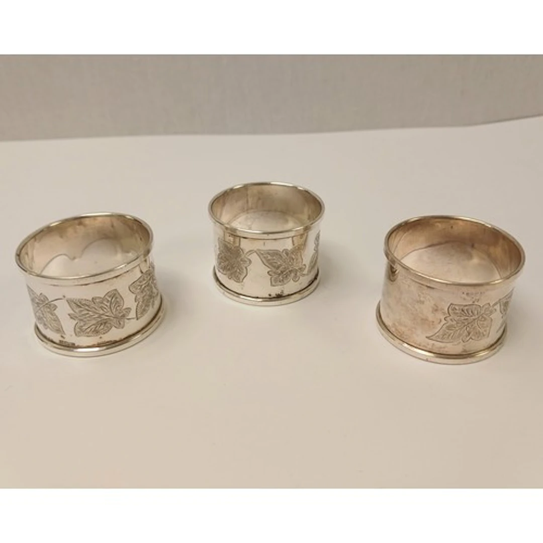 Set of three silver monogrammed napkin rings, gross weight 5...