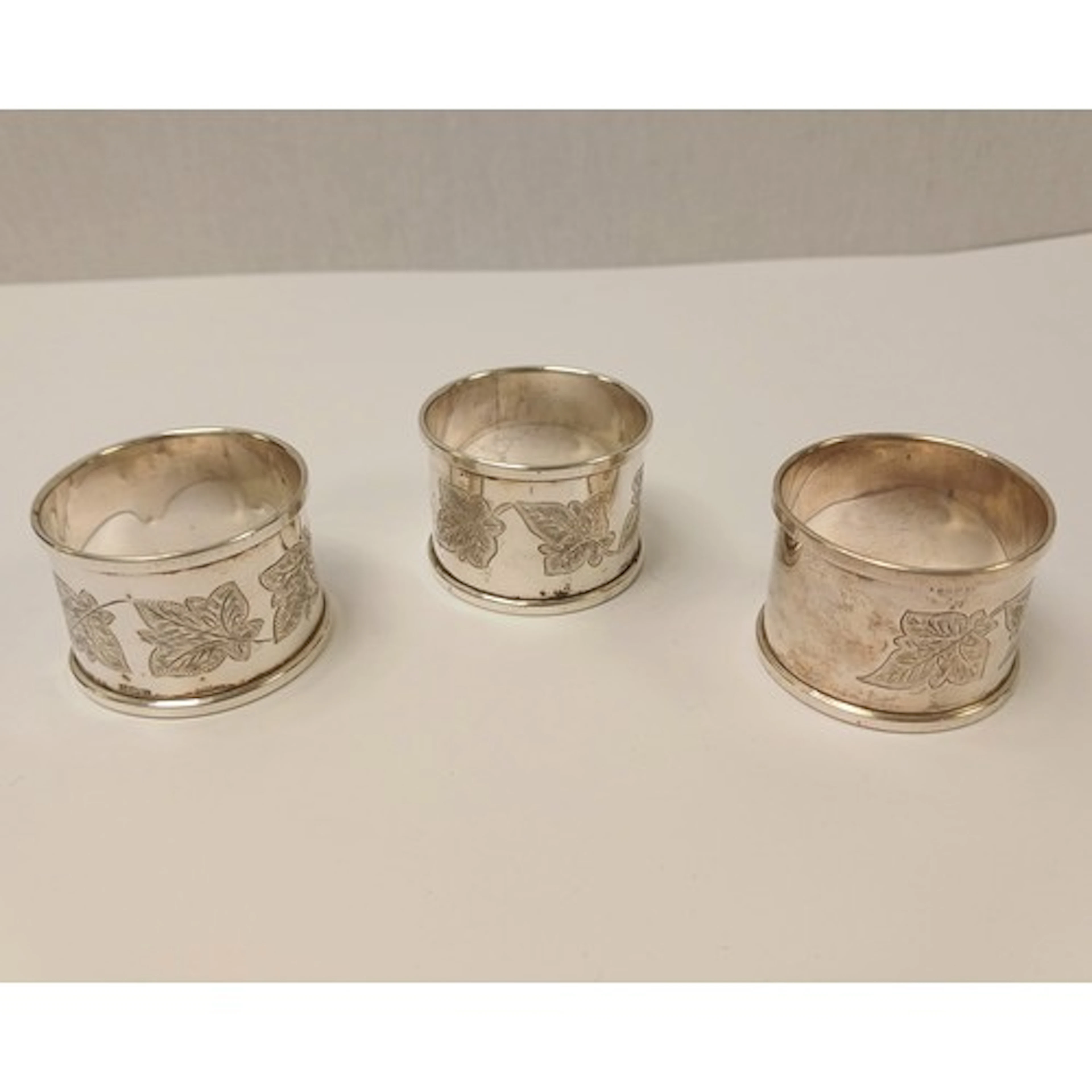 Set of three silver monogrammed napkin rings, gross weight 5...