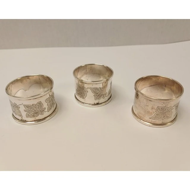 Set of three silver monogrammed napkin rings, gross weight 5...