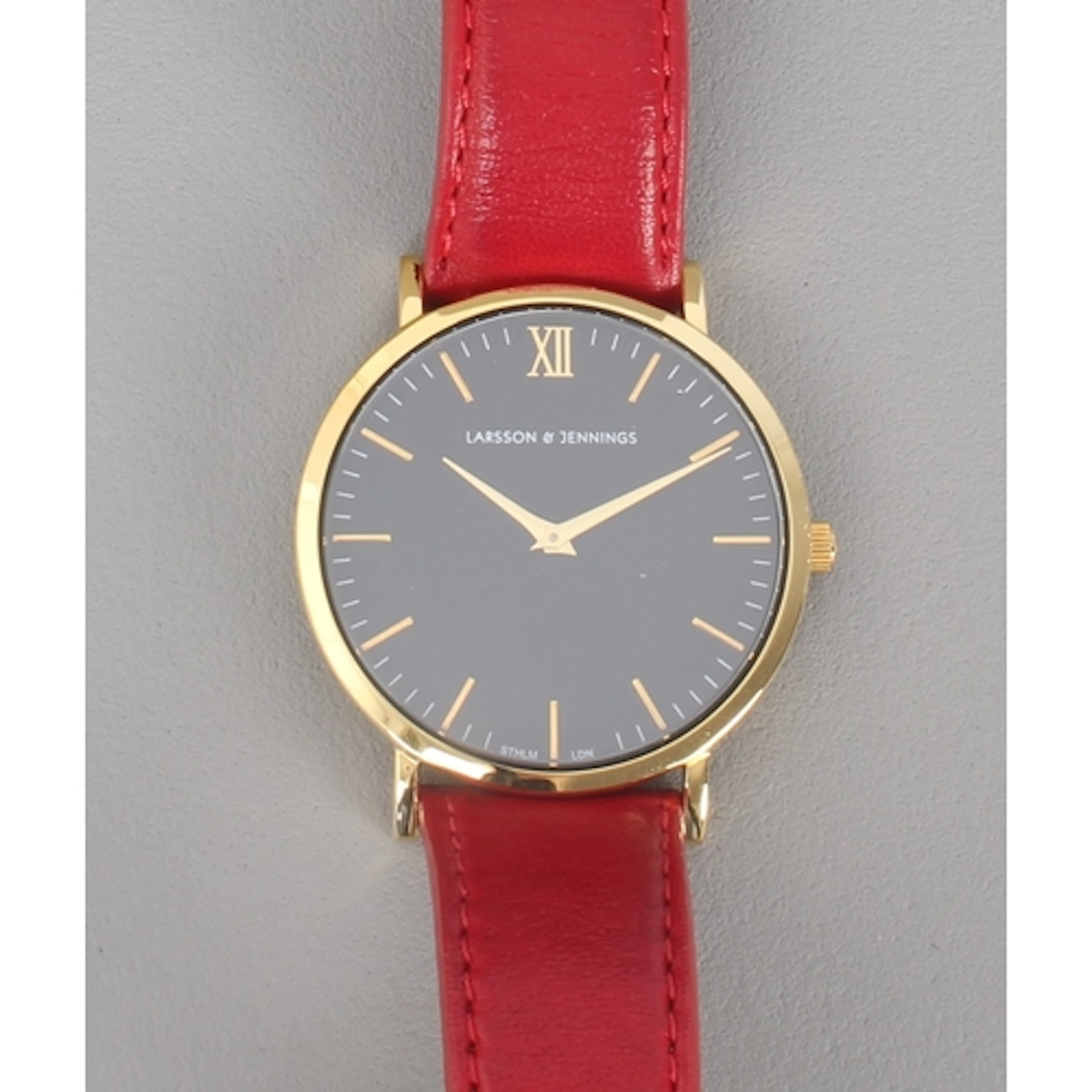 A gold plated stainless steel wrist watch by Larsson & Jenni...