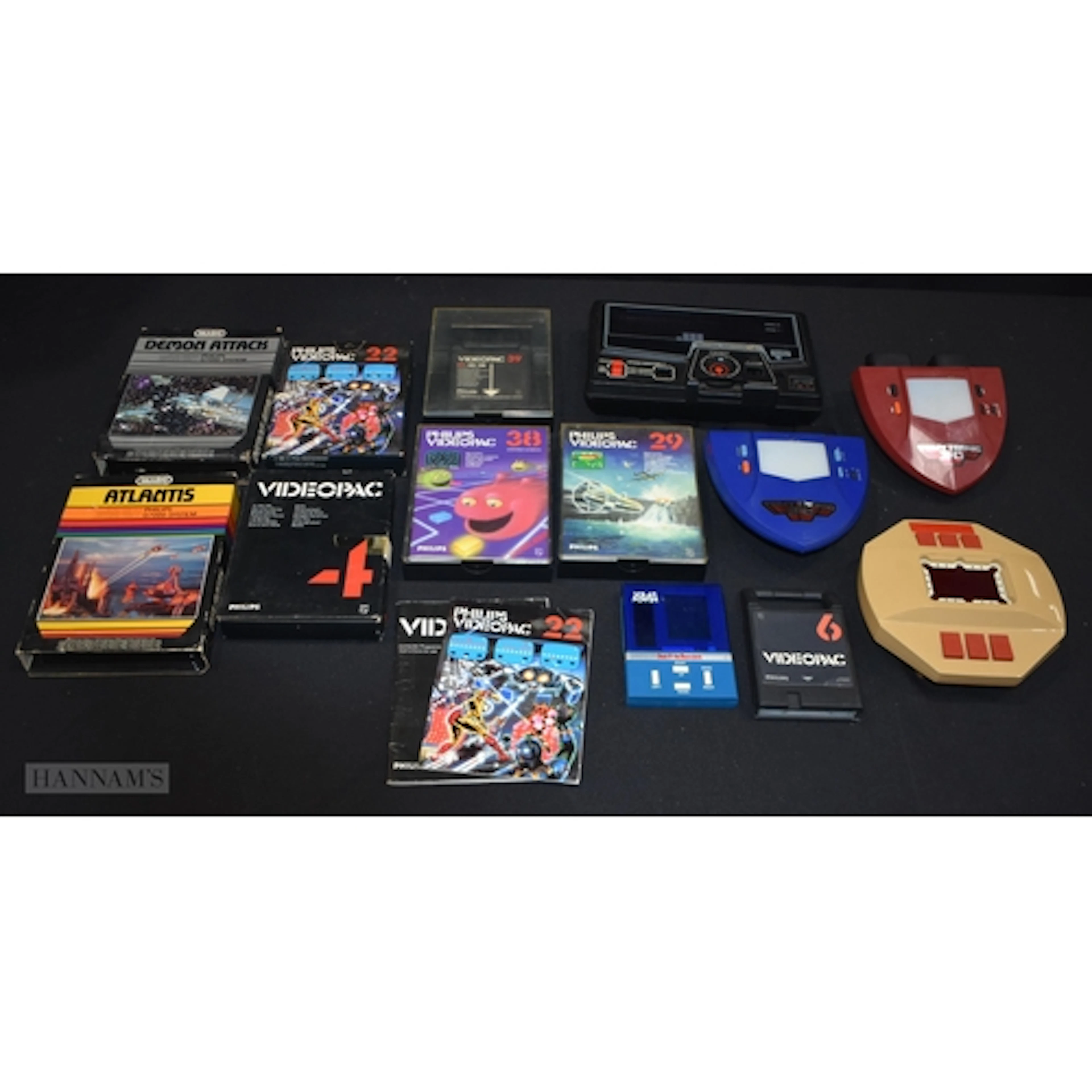 A collection of vintage battery operated game consoles toget...
