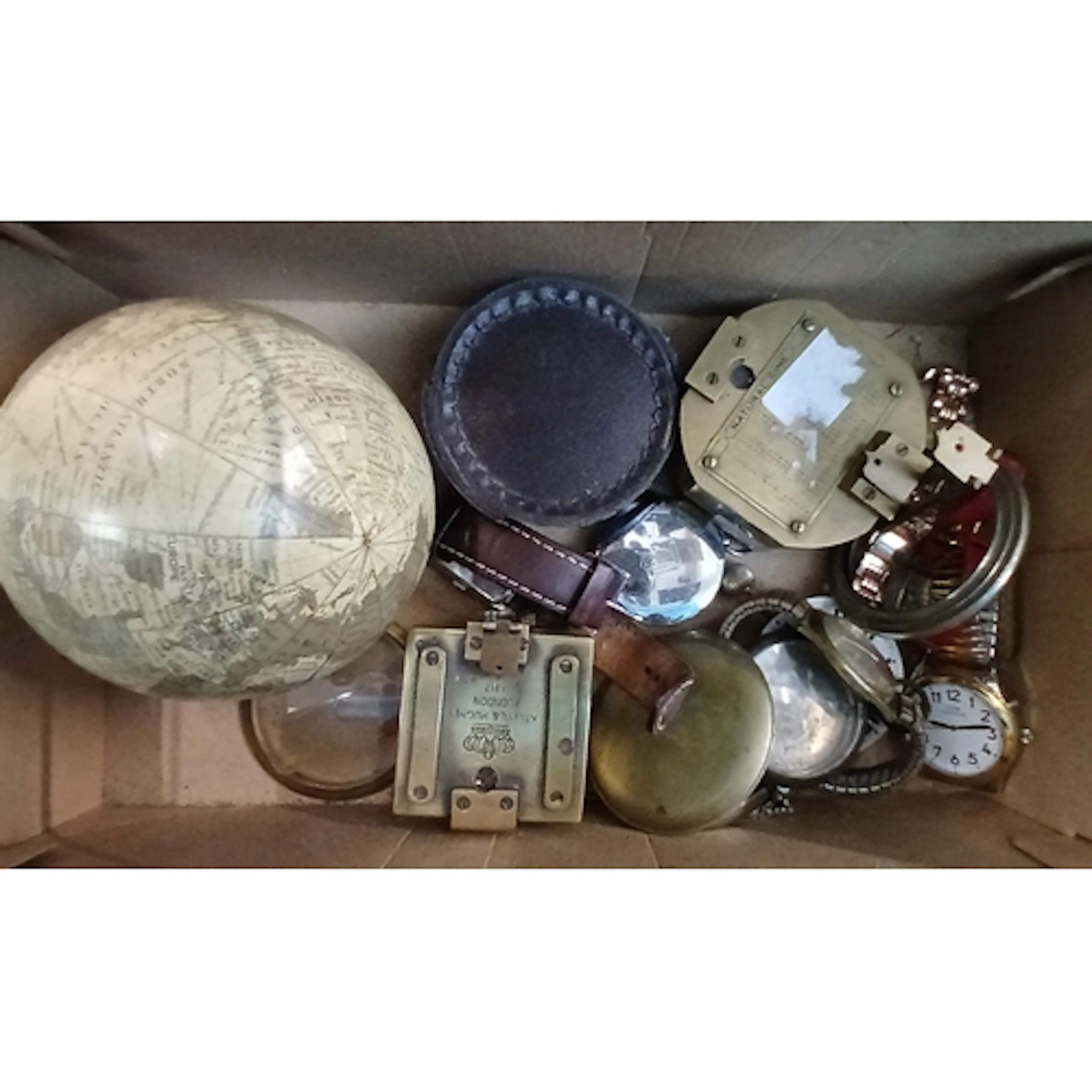 A box including watches, reproduction compasses and a globe ...