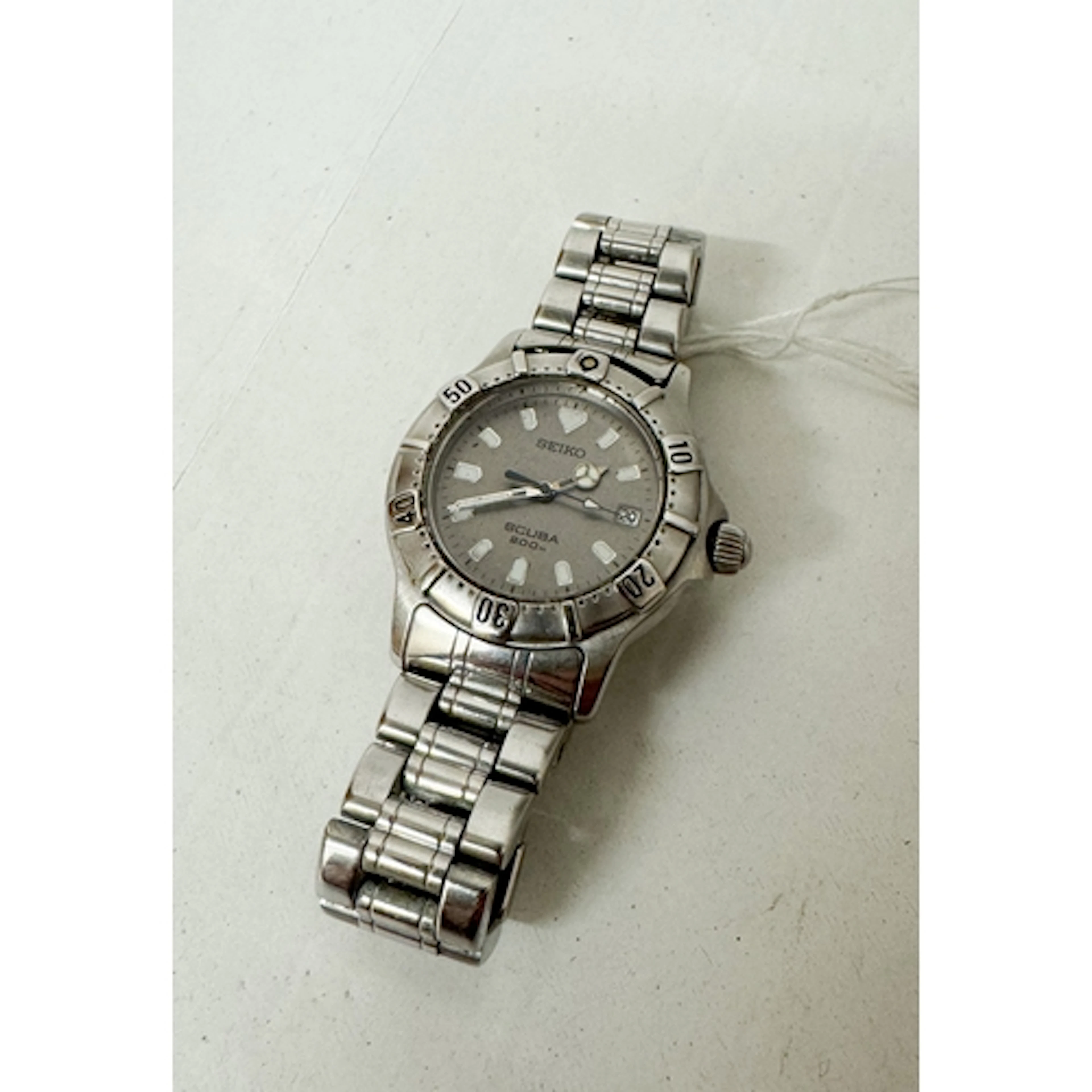 A gent's Seiko scuba diver's date quartz wrist watch on a st...