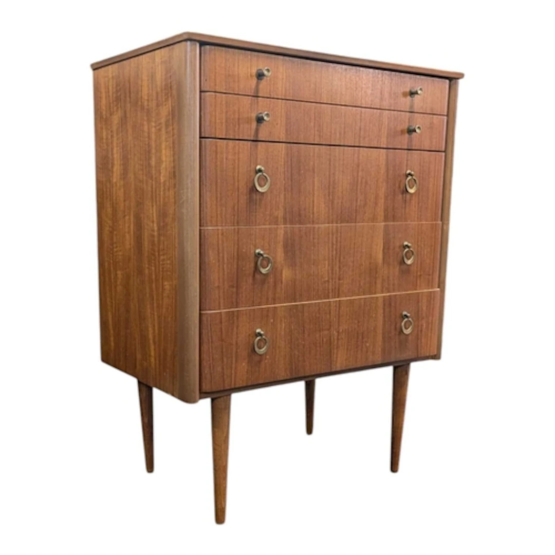 Schreiber Furniture - A mid century teak chest of drawers. R...
