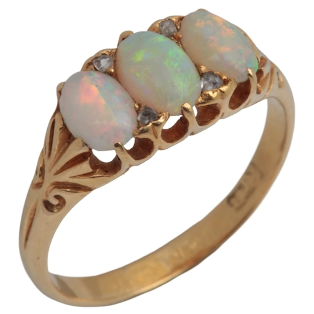 An opal and diamond ring, early 20th century, claw-set with ...