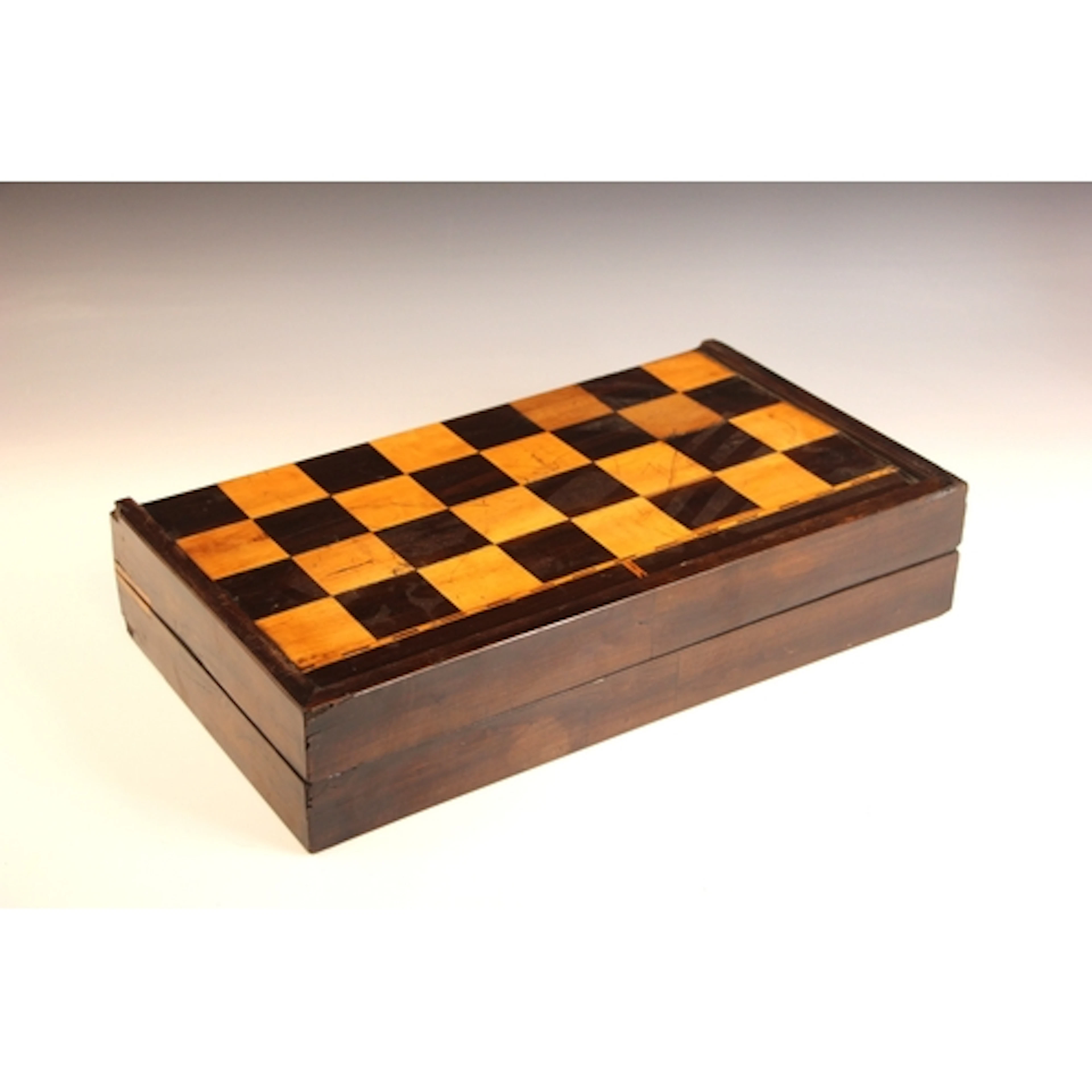 A William IV coromandel and satinwood chess board, of foldin...