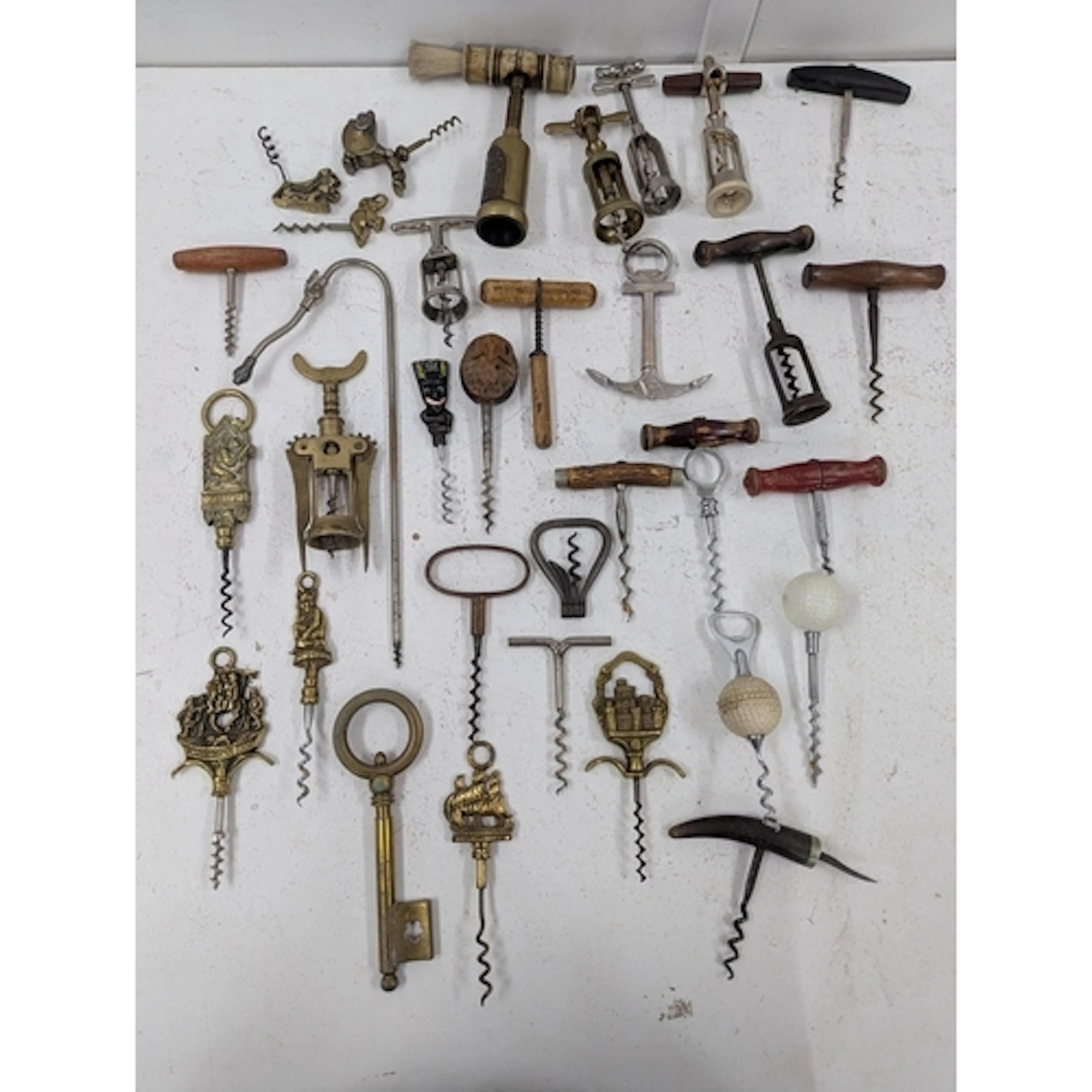Approximately forty corkscrews to include ones fashioned as ...
