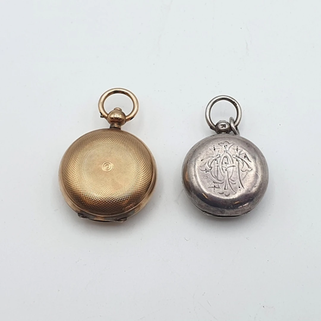 A silver Sovereign Case, Birmingham 1893 and a gold-plated D...