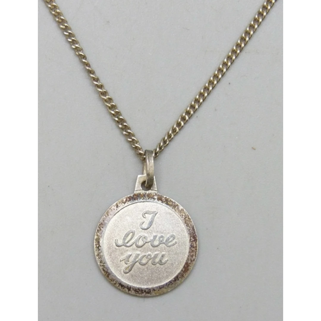 A silver 'I Love You' disc pendant on a silver chain, 2.2cm ...