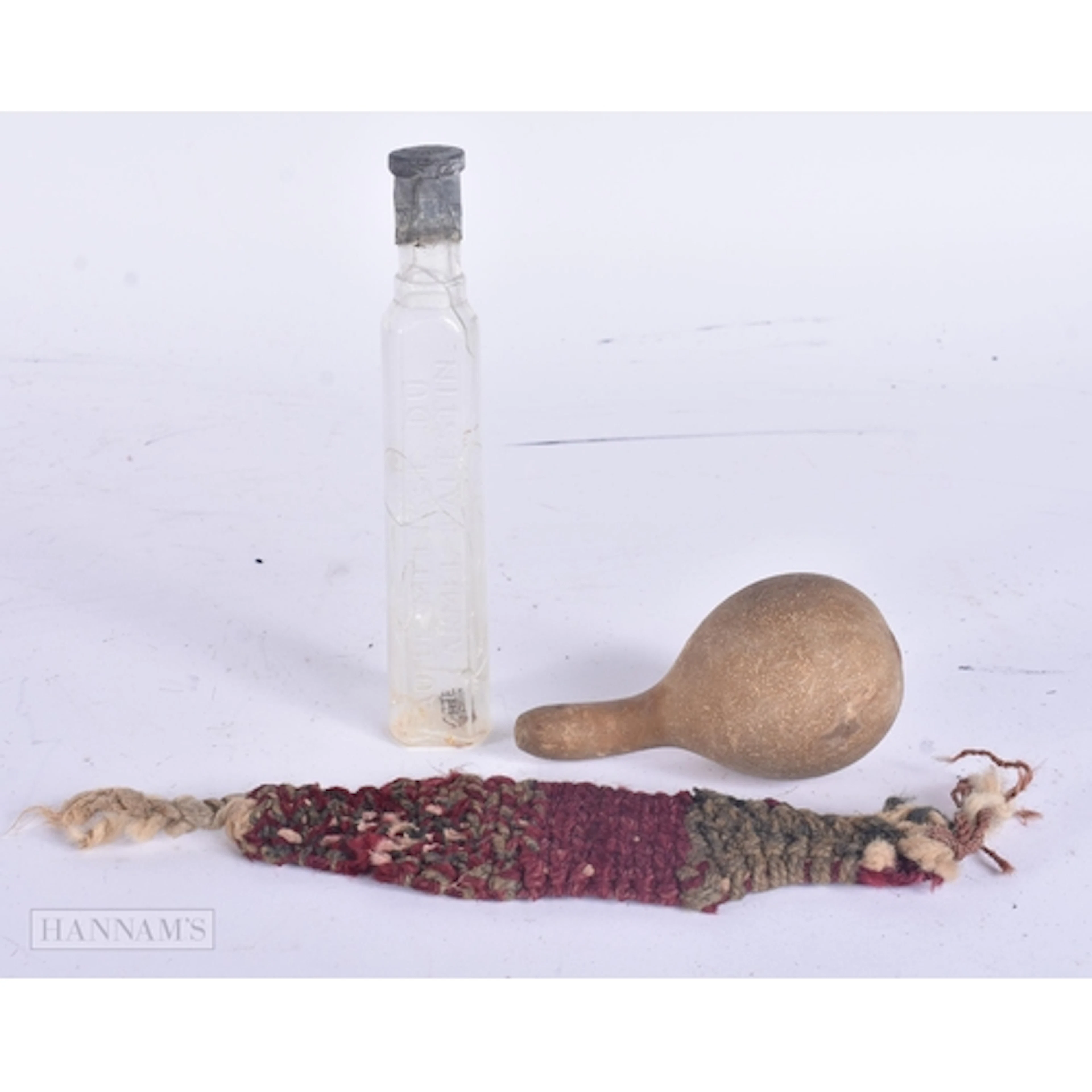 AN ANTIQUE PALESTINIAN GLASS BOTTLE together with an early r...