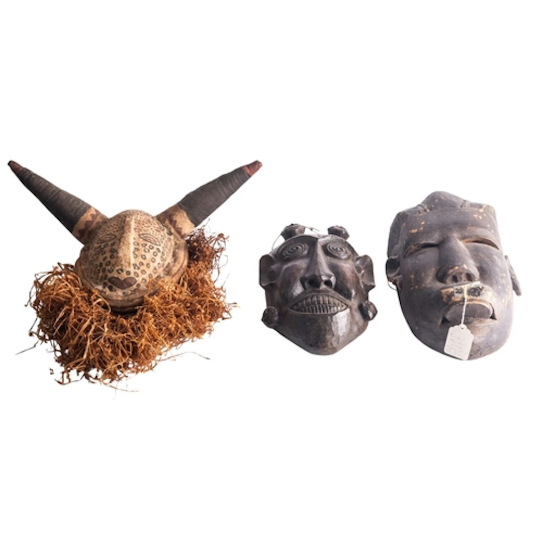 A tribal mask, polychrome decorated fabric in stylized bull,...