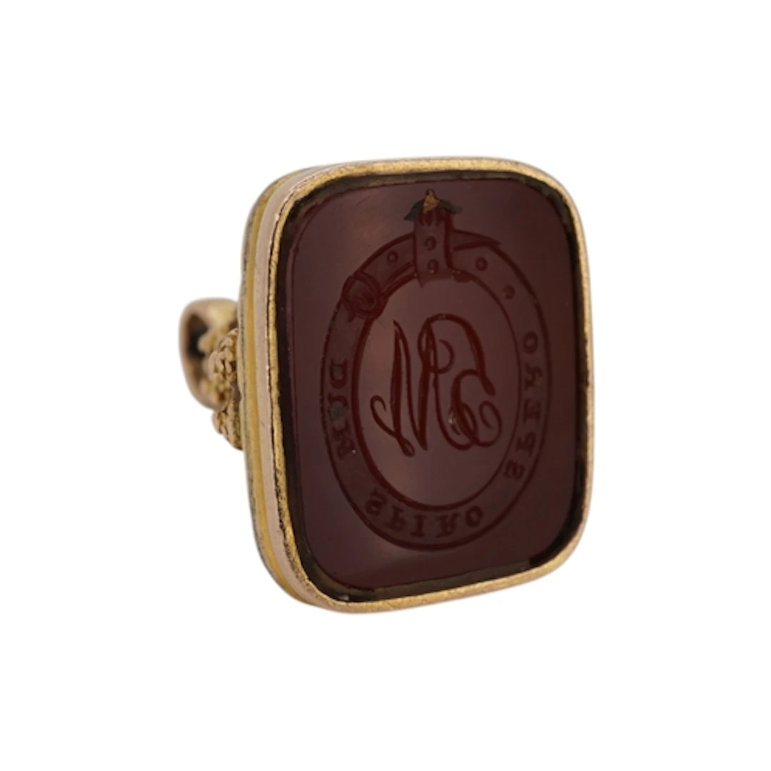 A 19th century yellow metal and carnelian seal, with canneti...