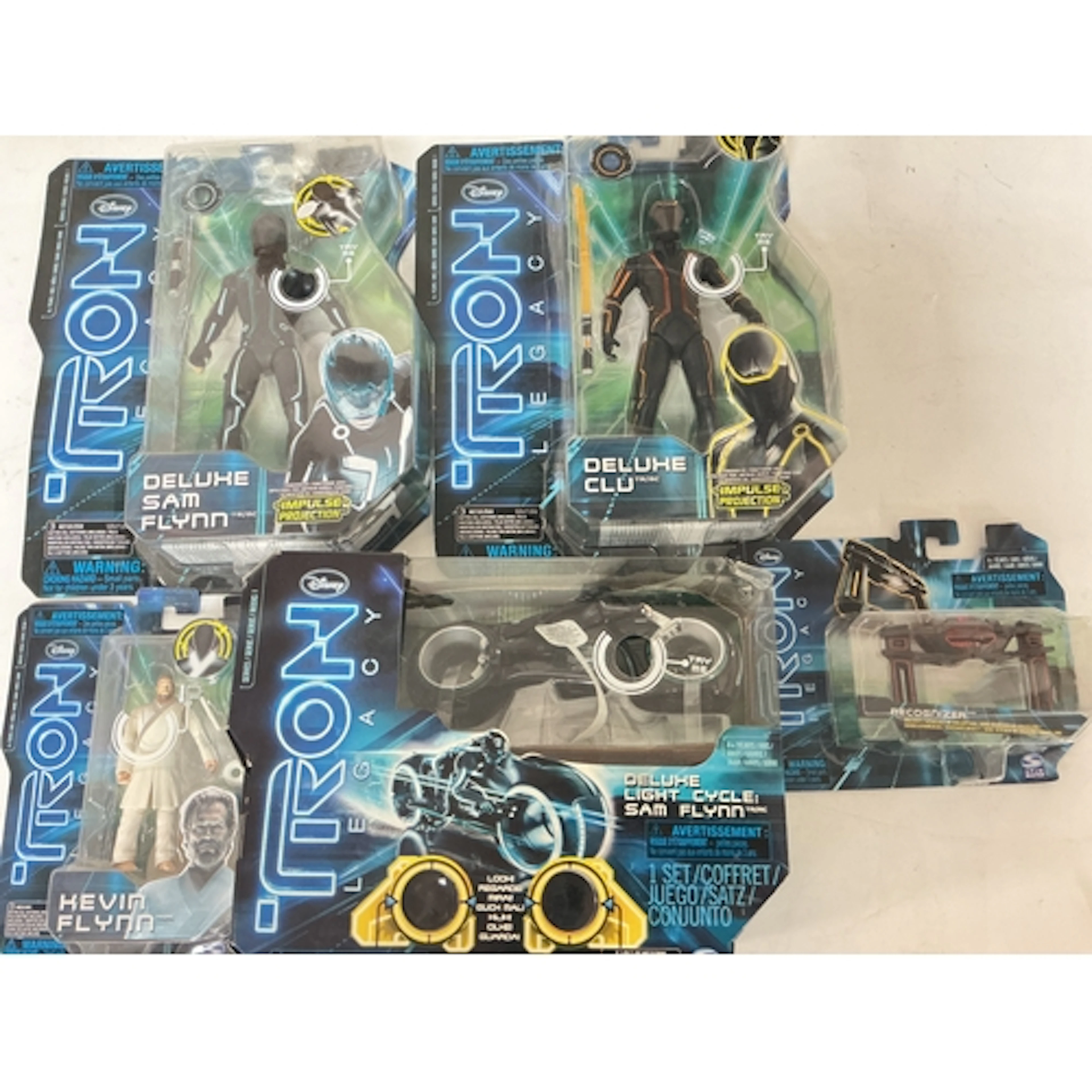 A Small Collection Of Boxed Tron Legacy Toys. No Reserve.