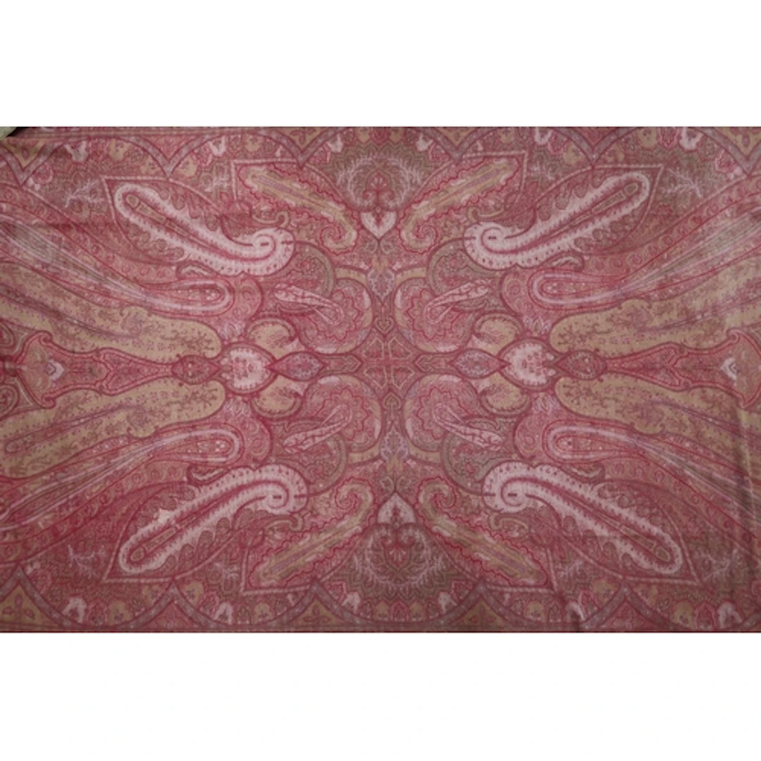 A red ground Paisley shawl woven with elongated boteh and pa...