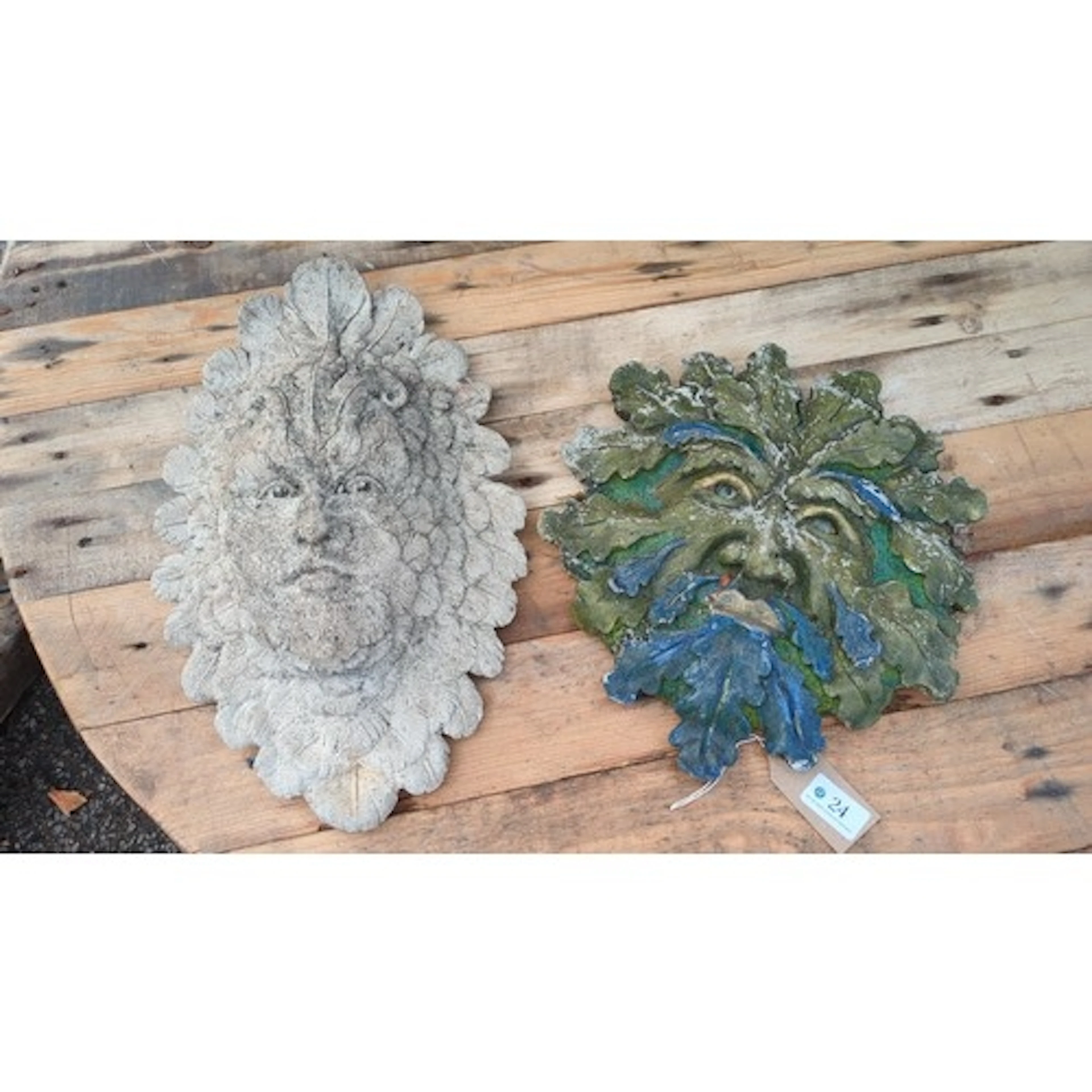 A pair of garden wall masks modelled as foliate Green Men, c...