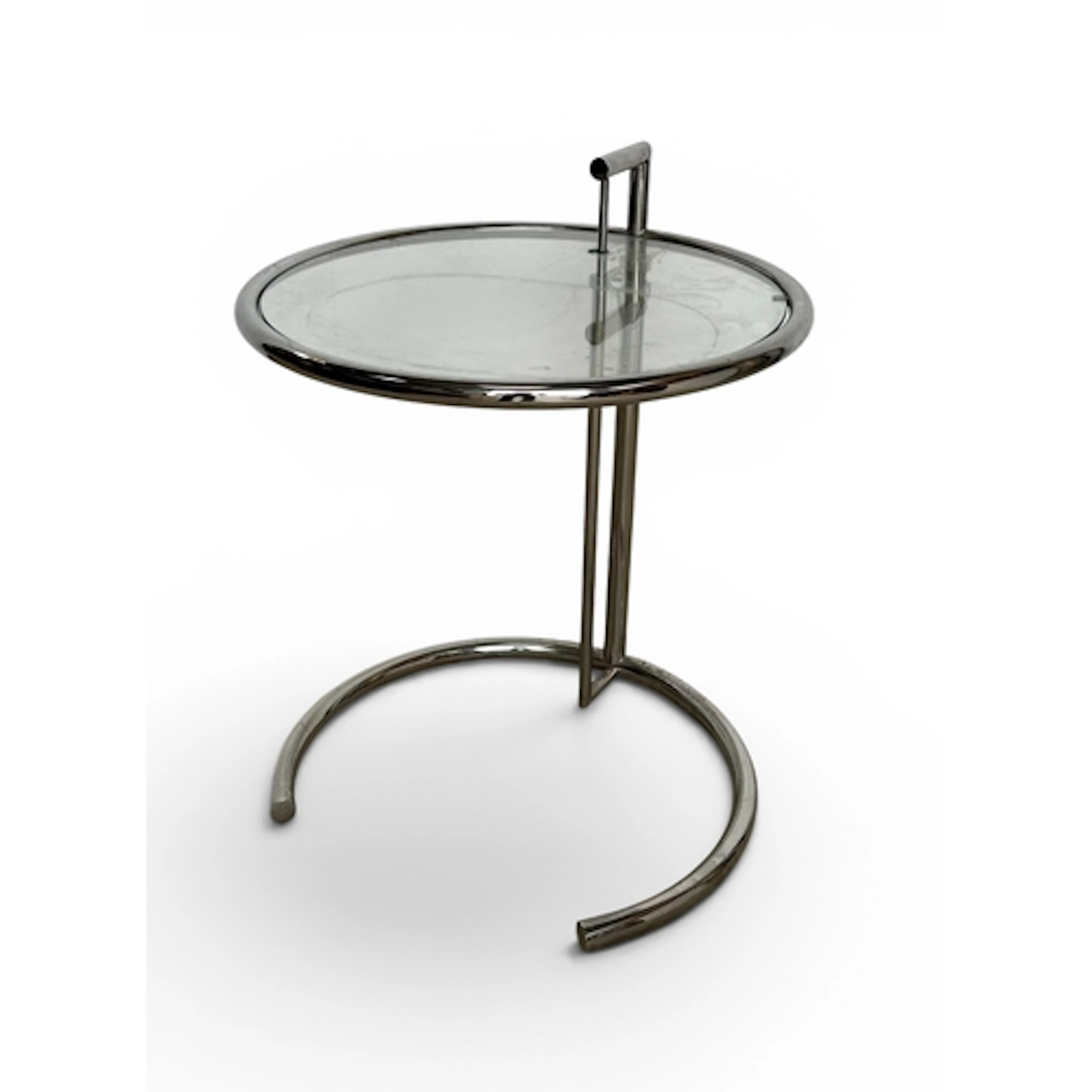 ATTRIBUTED TO EILEEN GRAY: A METAL FRAME CIRCULAR GLASS TOP ...