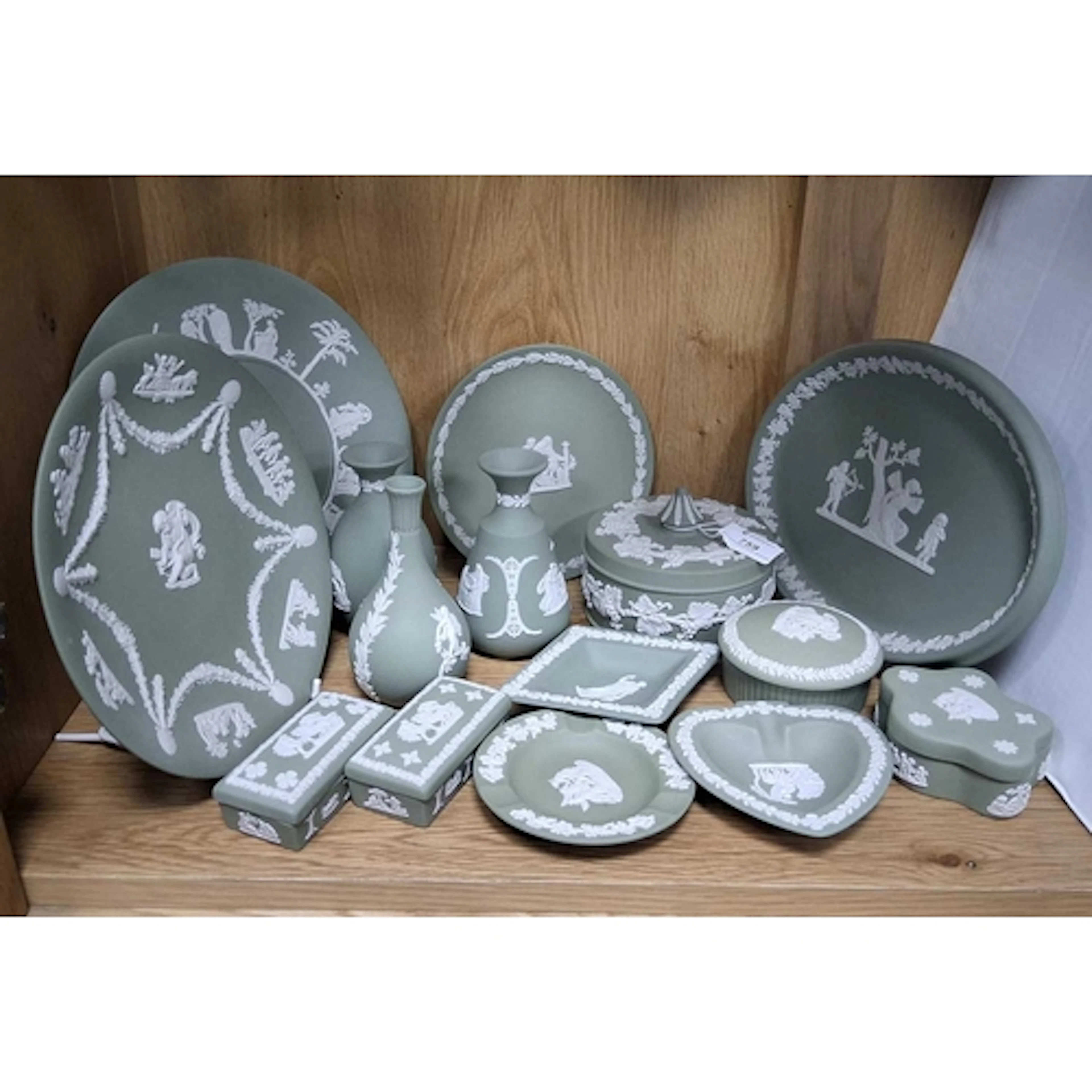 A GROUP OF WEDGWOOD SAGE GREEN JASPERWARE, comprising round ...