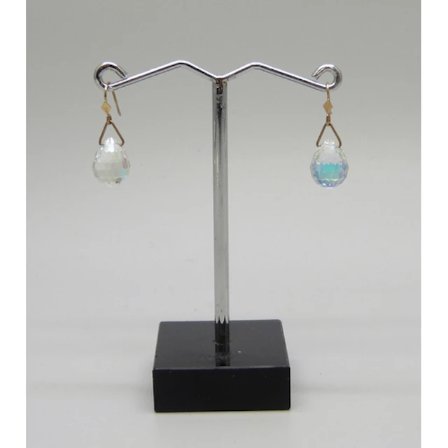 A pair of aurora borealis glass earrings on yellow metal hoo...
