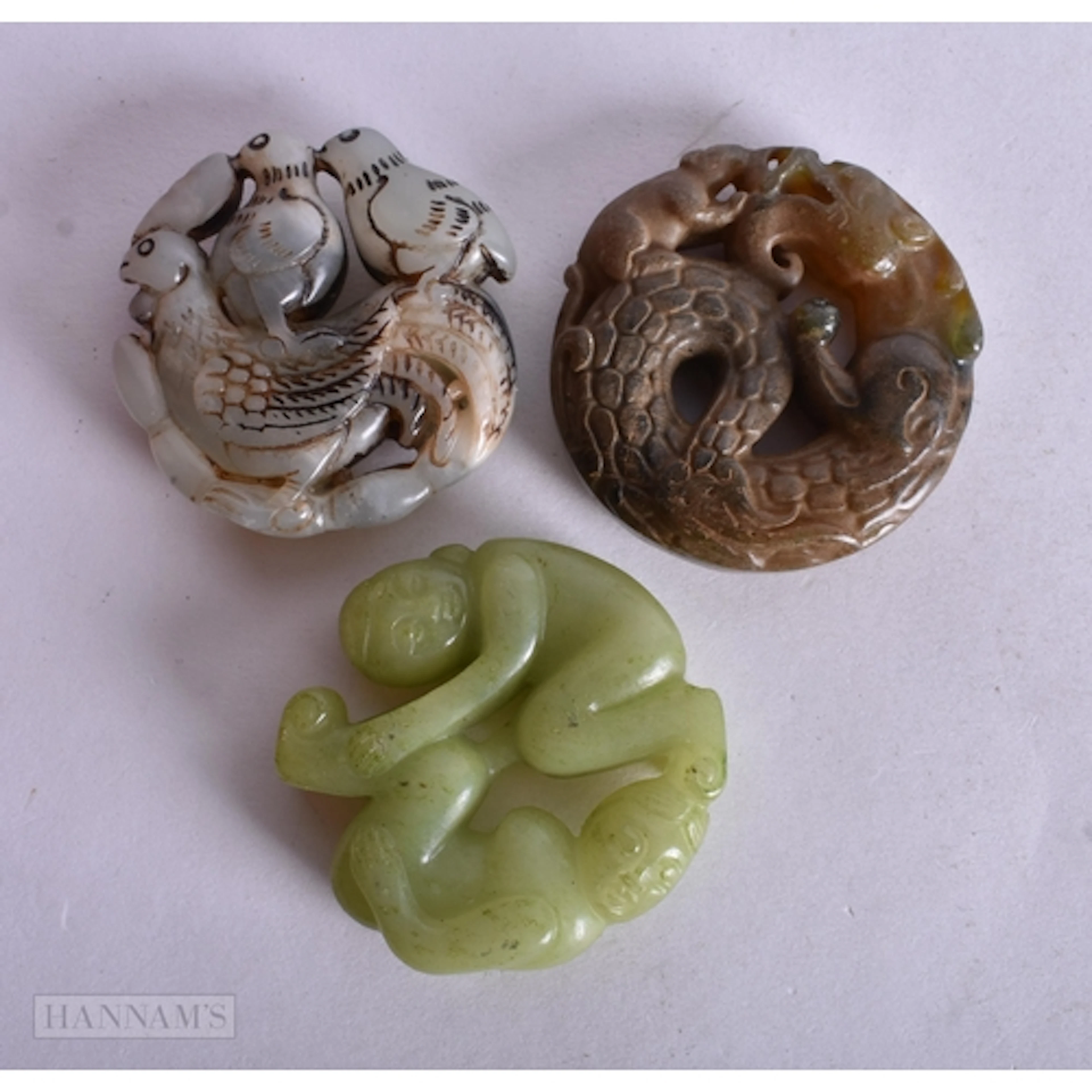 THREE CHINESE CARVED JADE ROUNDELS. 5 x 1.4 cm. (3)