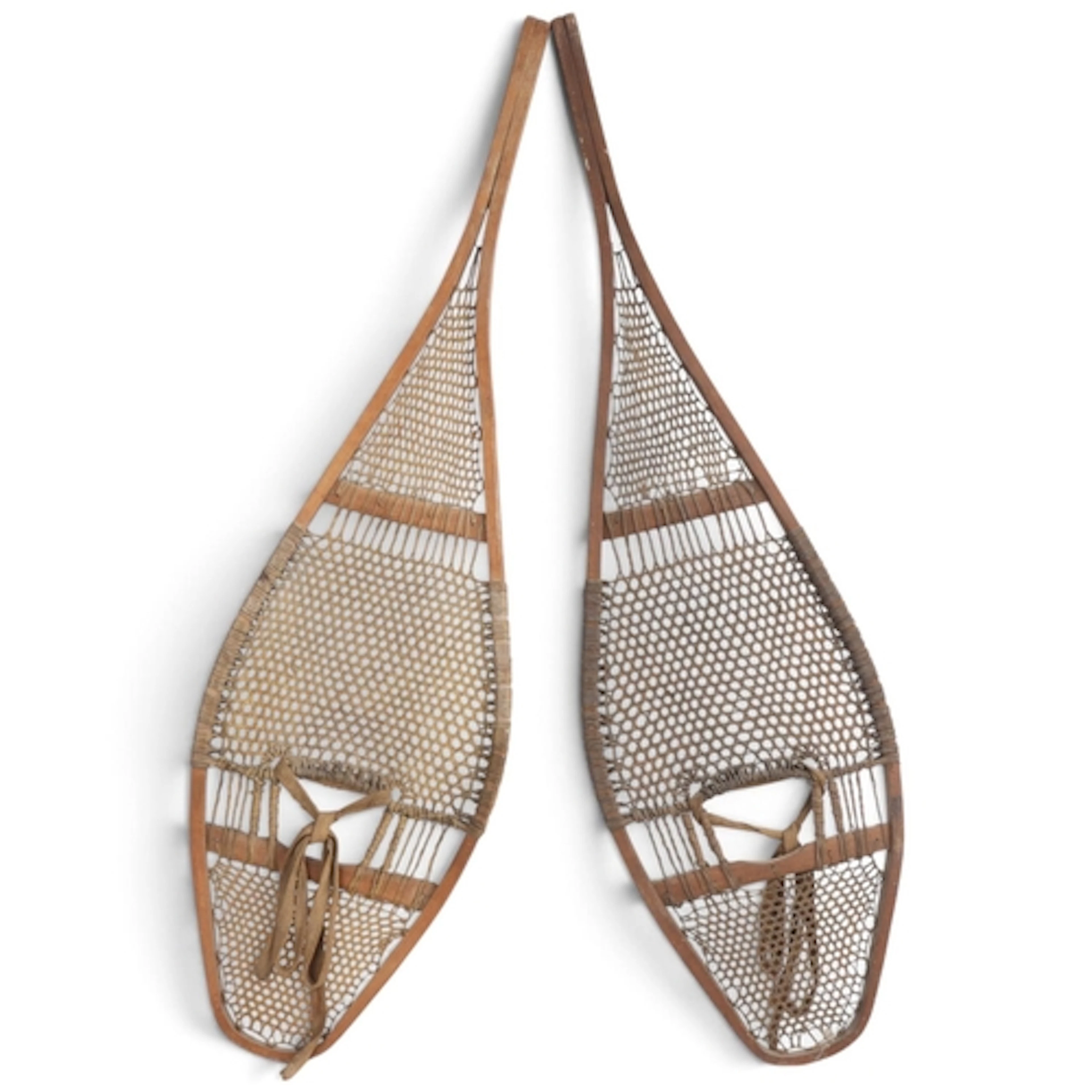A pair of Native American snow shoes with rawhide lacing, le...