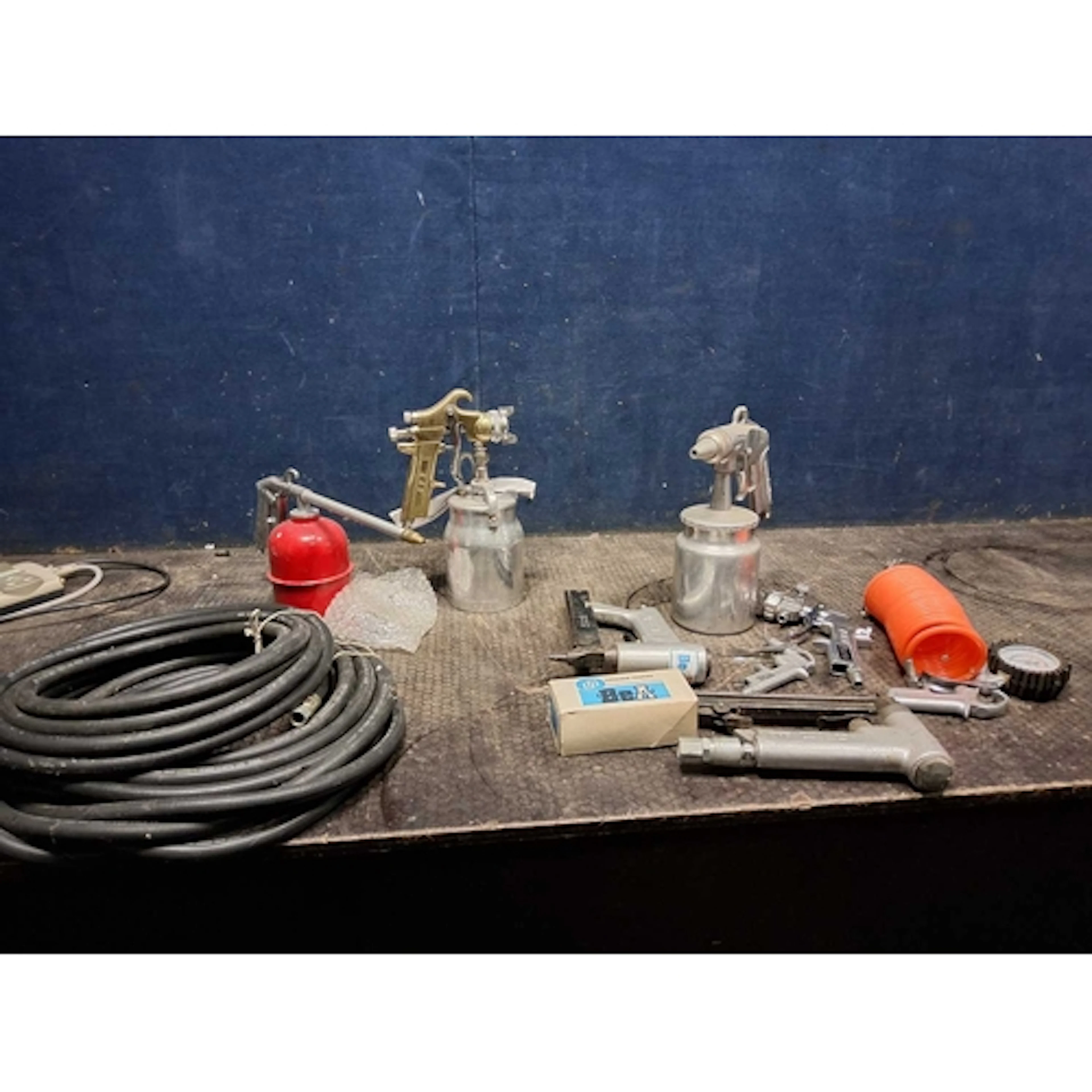 A COLLECTION OF PNUEMATIC TOOLS AND ACCESSORIES including a ...