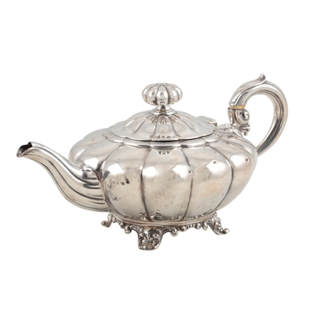 A William IV silver melon shaped teapot, by The Barnards, wi...
