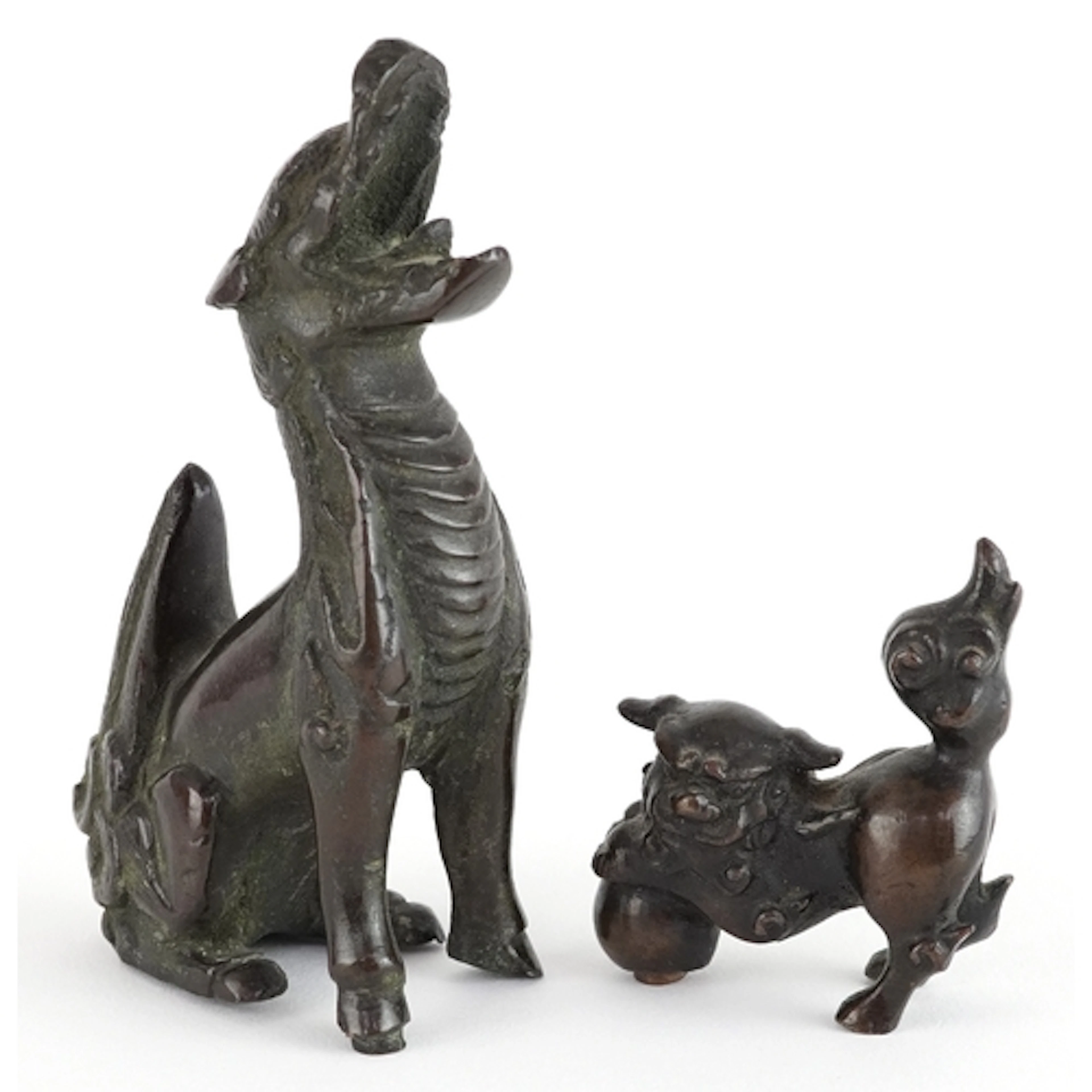 Two Chinese patinated bronze temple dogs, the largest 8.5cm ...