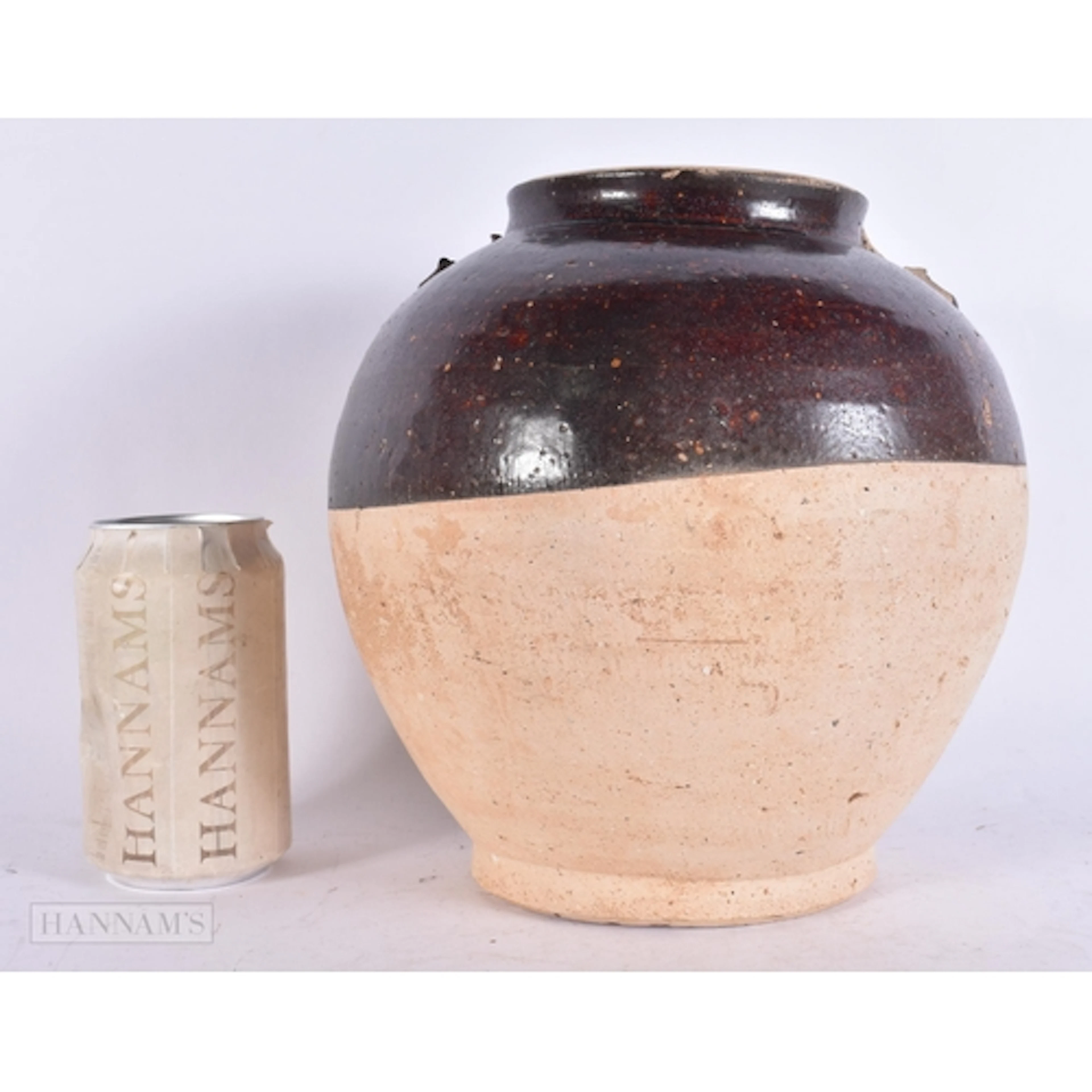 A CHINESE TANG DYNASTY BROWN GLAZED POTTERY VASE (AD 618-907...