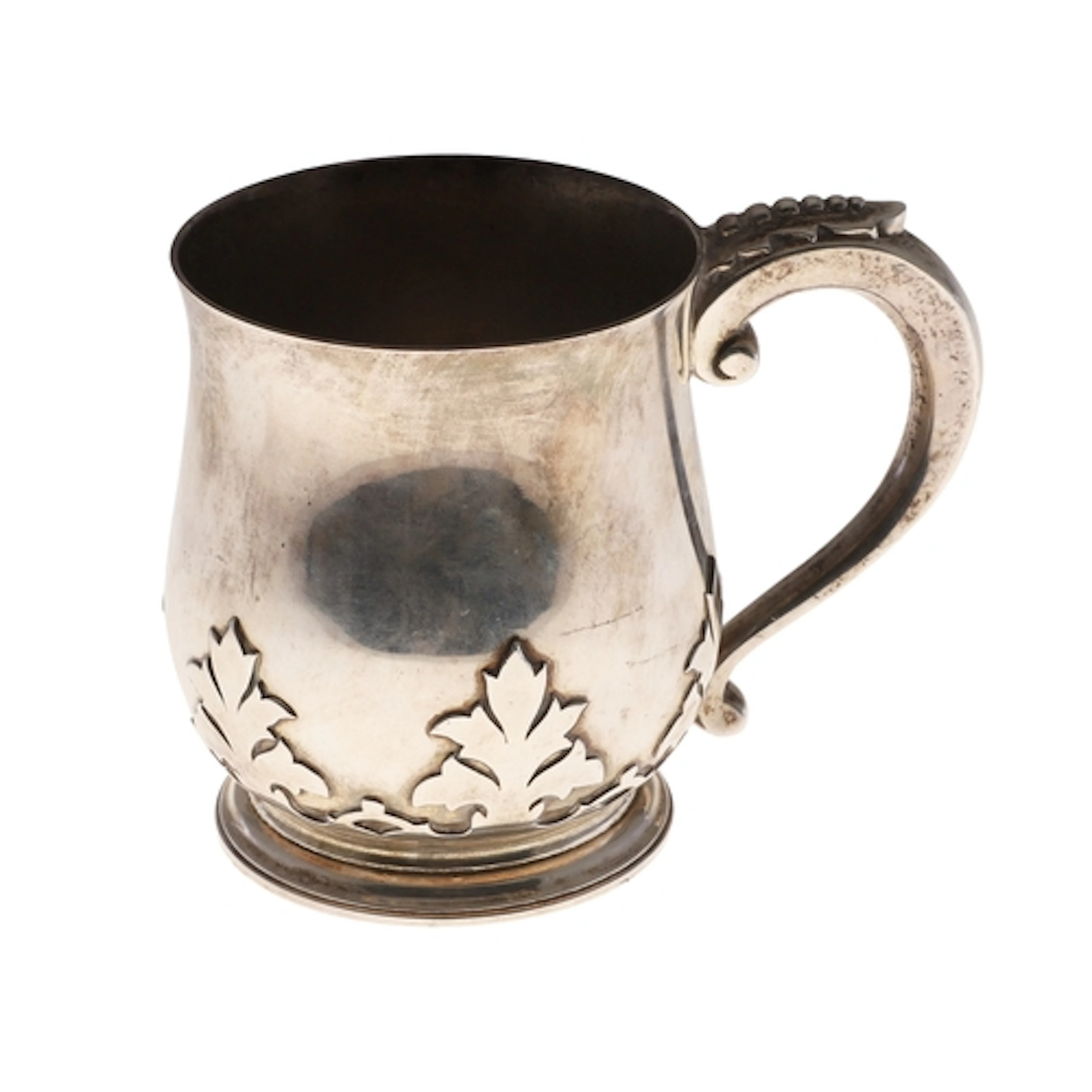 A GEORGE V SILVER MUG. Of baluster form with scroll handle, ...
