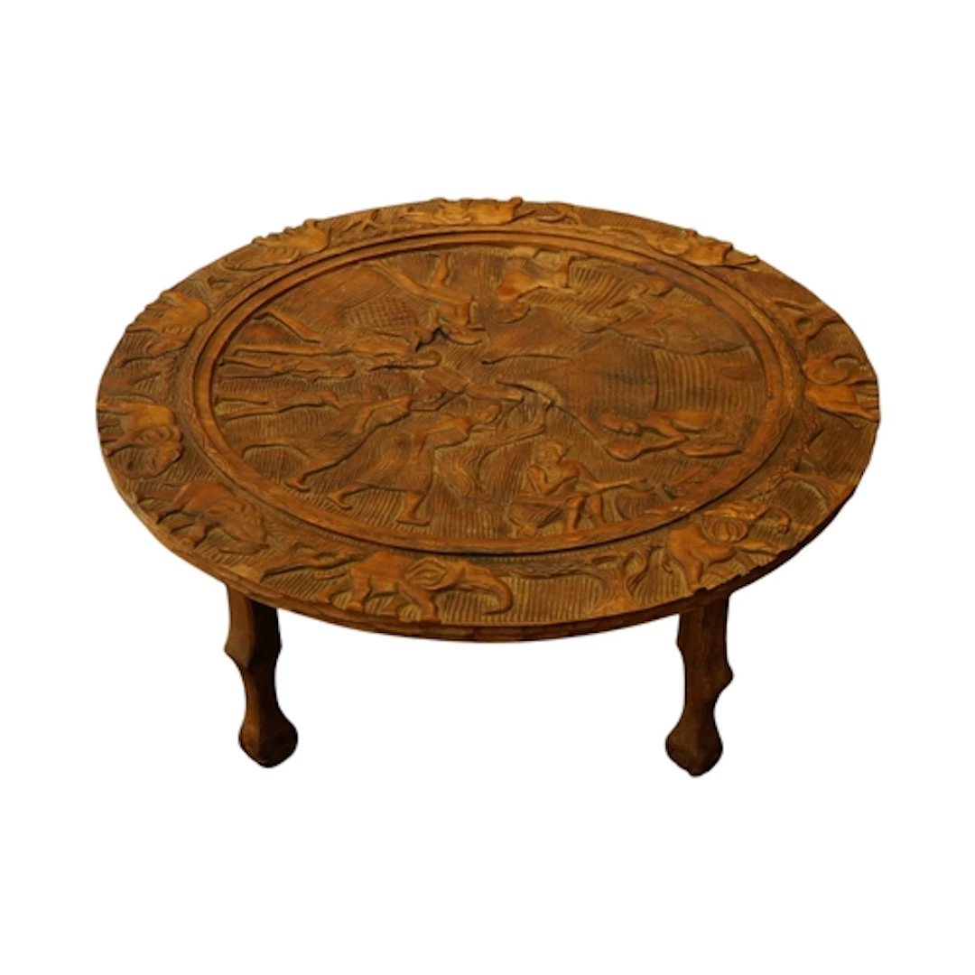 An African carved wood circular table, diameter 100cm