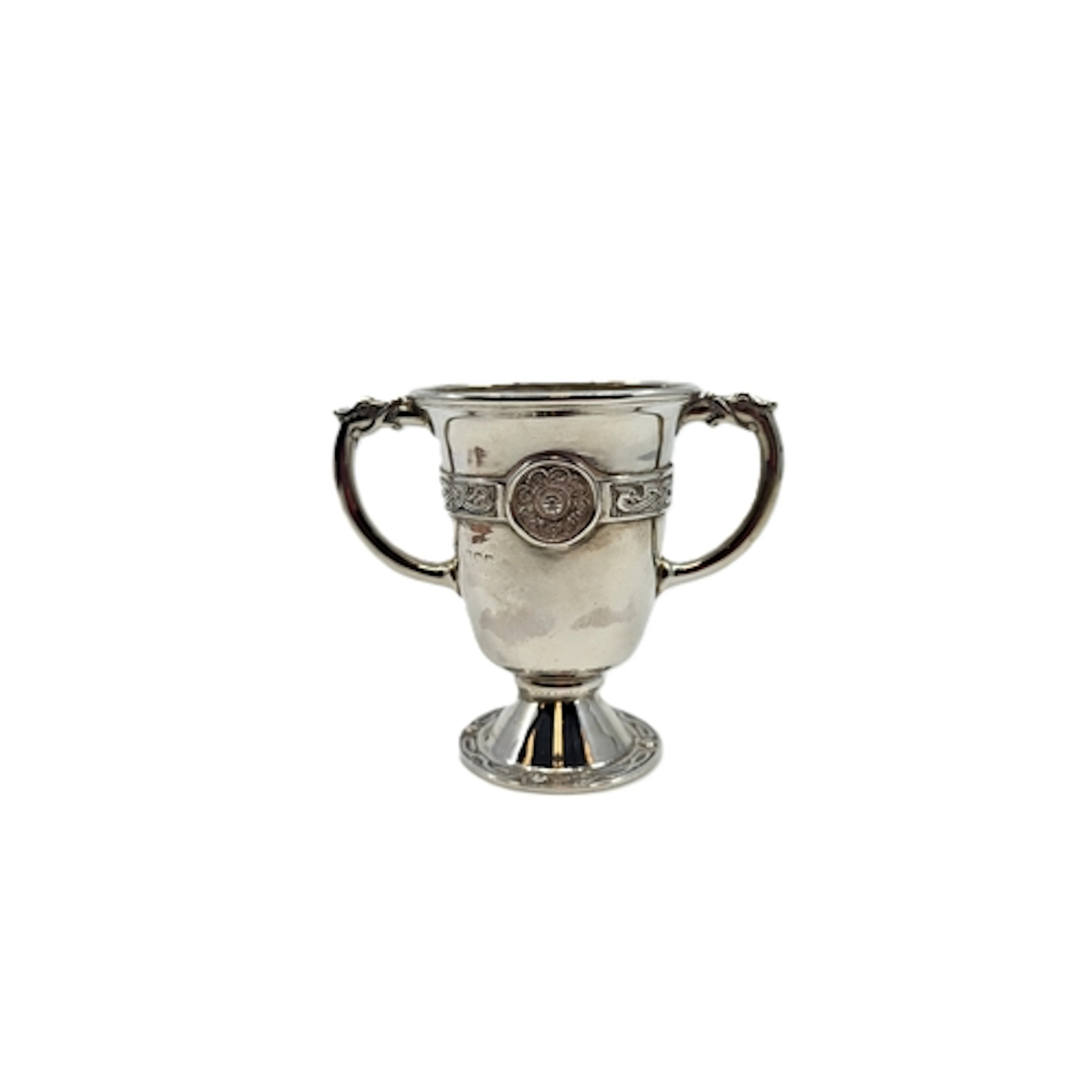 A 1920s TWO HANDLED STERLING SILVER CUP, with Celtic revival...