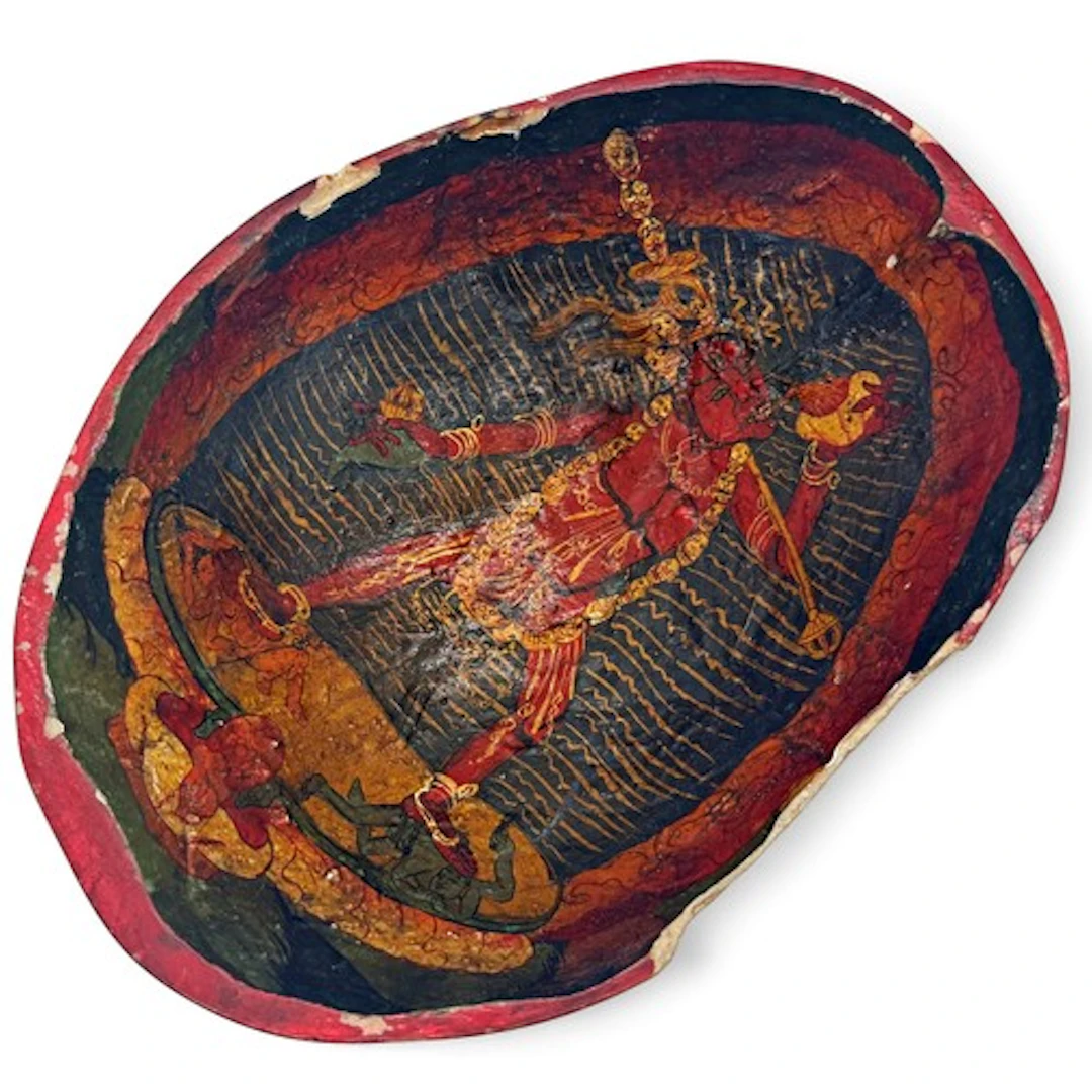 A Tibetan painted Kapala, the human skull bowl painted to th...