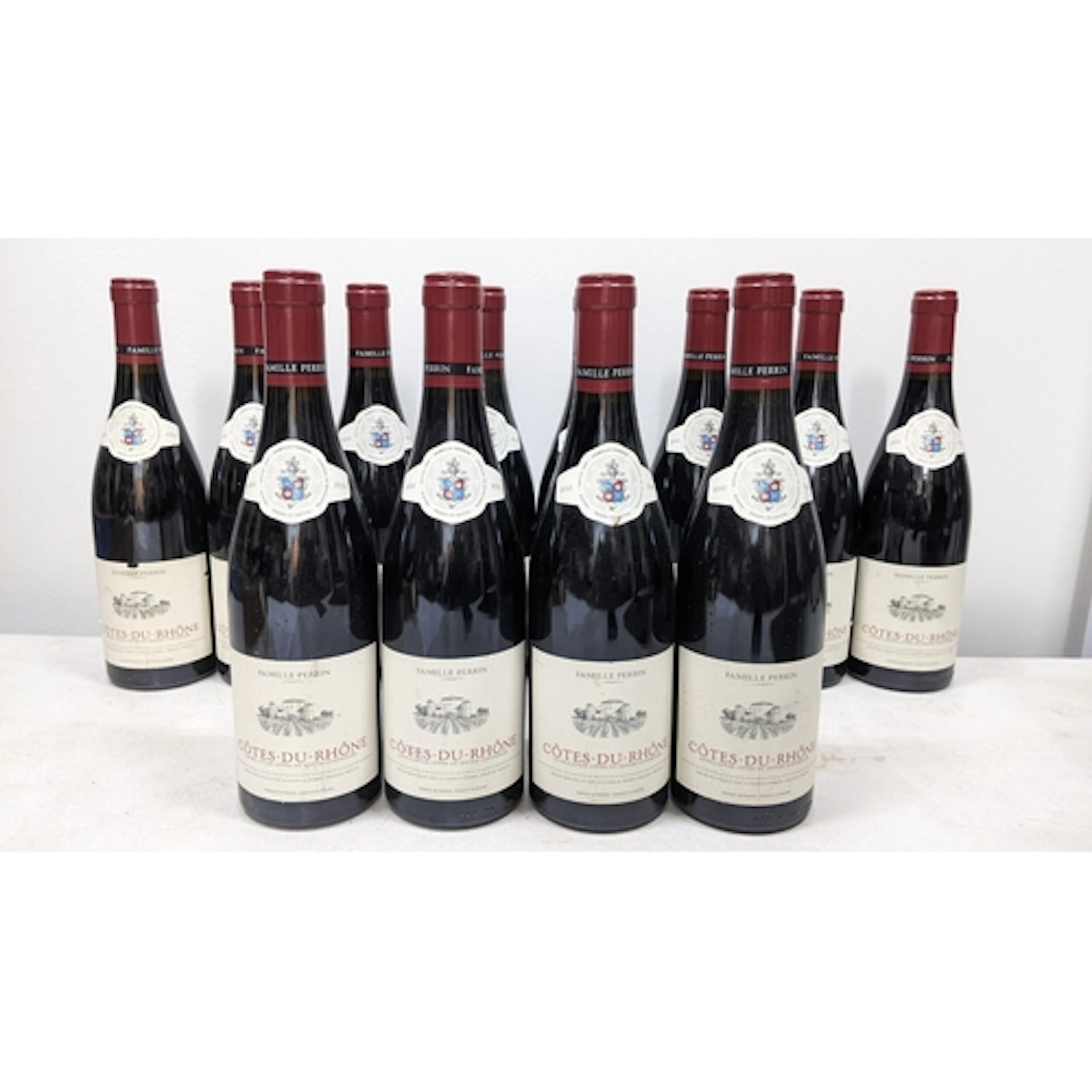 Twelve bottles of 2012 Famille Perrin Côtes-du-Rhône red win...