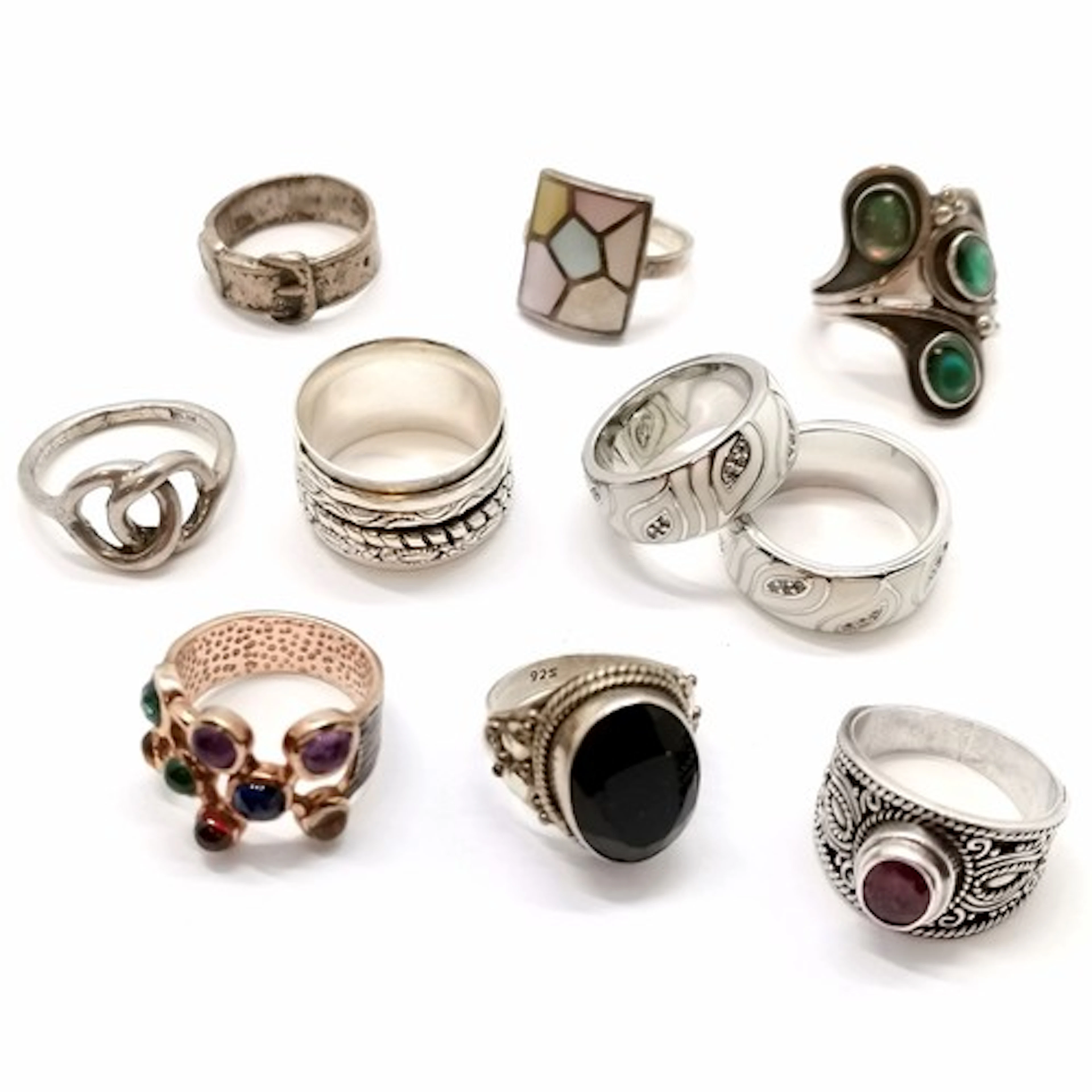 10 x silver marked rings inc stone set, buckle, spinner etc ...