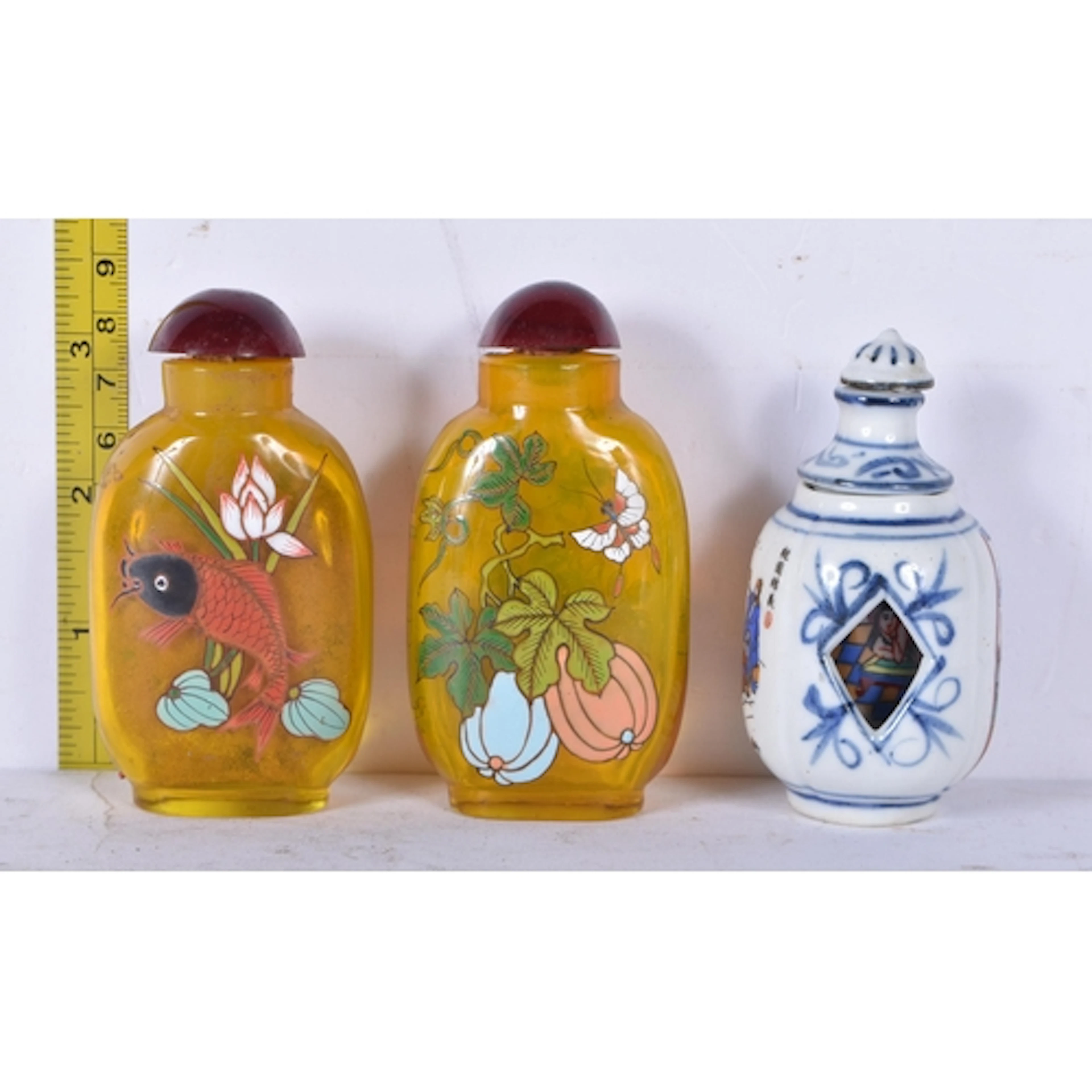 A porcelain snuff bottle with an erotic revolving centre tog...