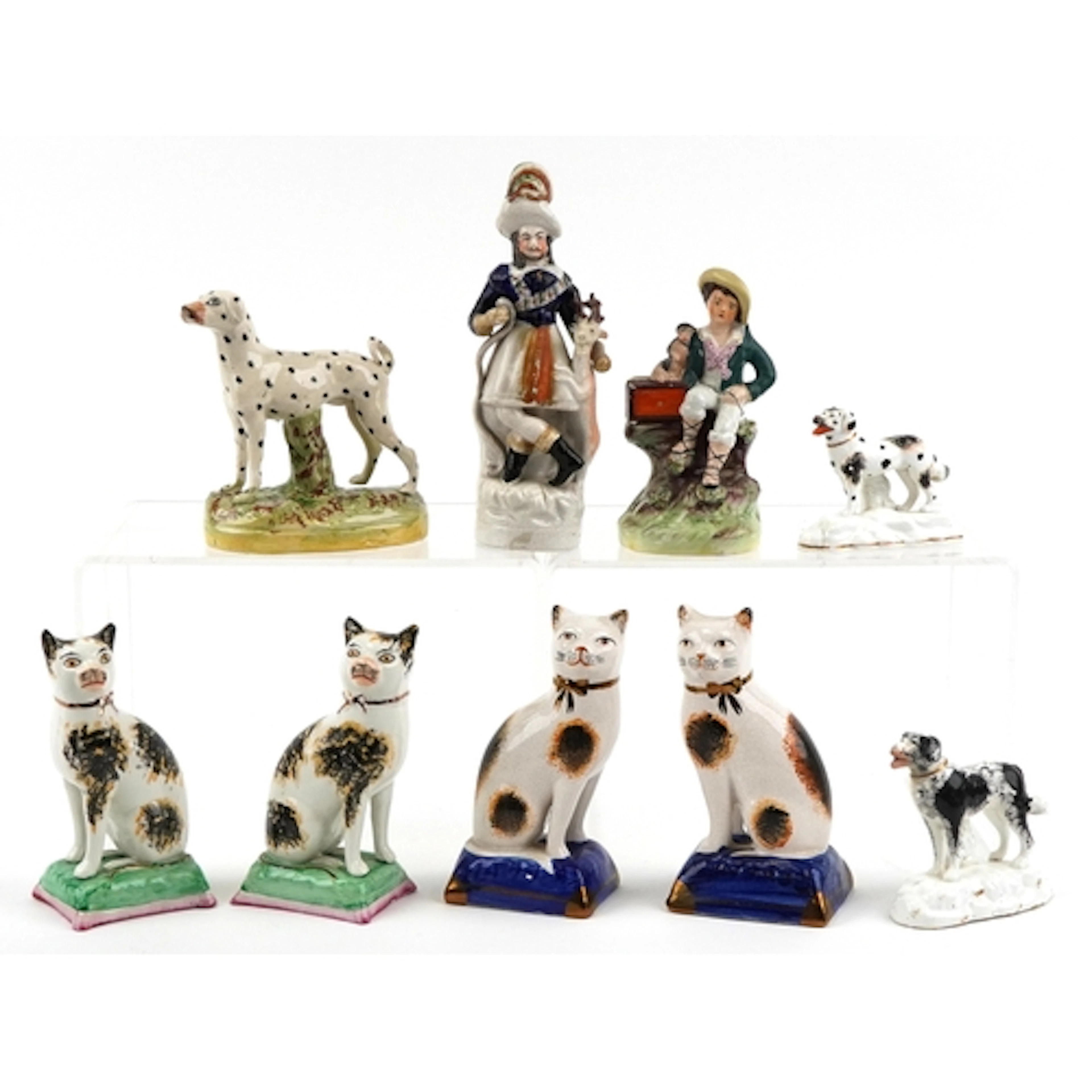 Nine Victorian Staffordshire pottery figures including two p...
