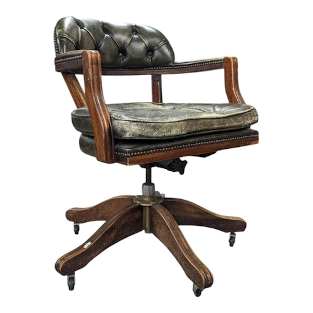 A 20th century Chesterfield style captain style swivel offic...