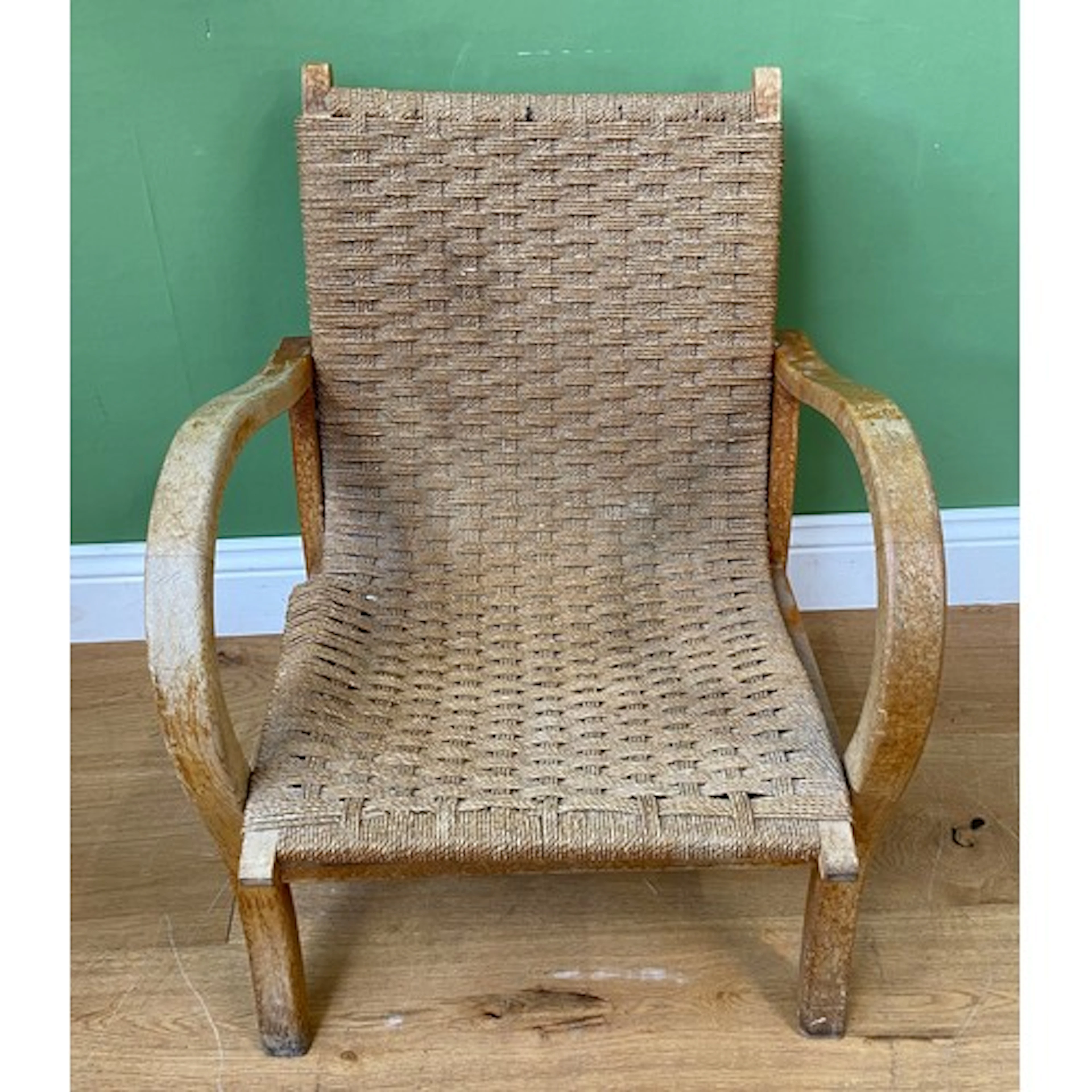 An Art Deco German Bauhaus beech and rattan open armchair, 5...