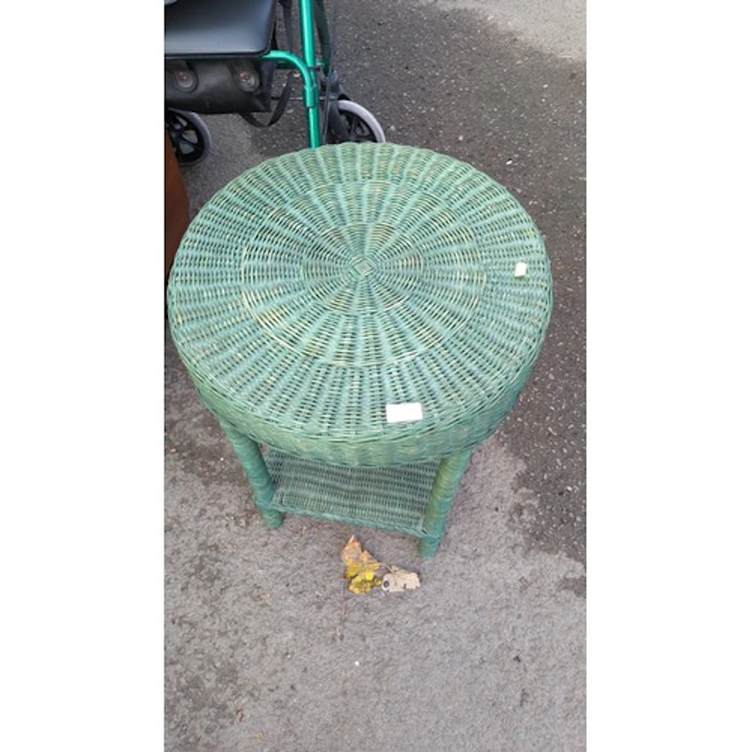 Green-painted wicker occasional table with a circular top wo...