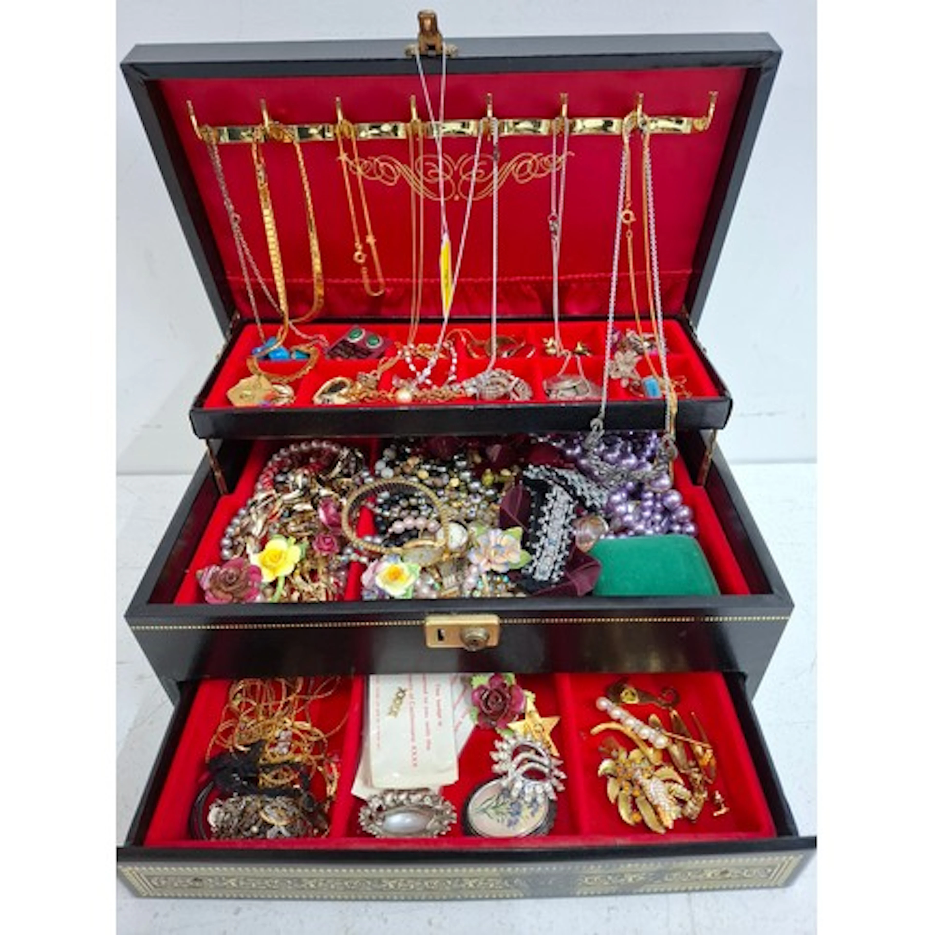 A late 20th Century black jewellery box and contents to incl...