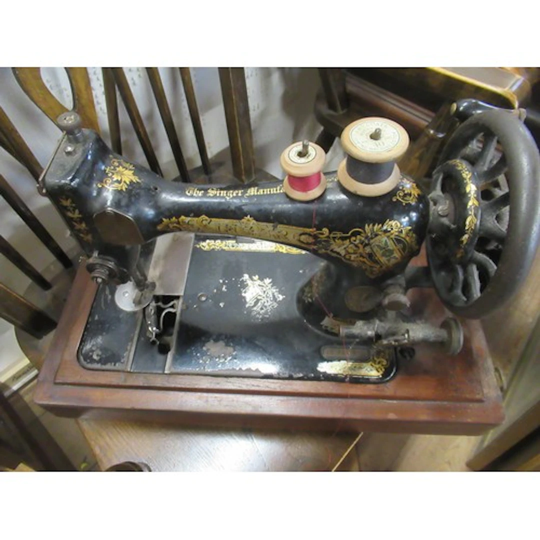 Three antique cased sewing machines