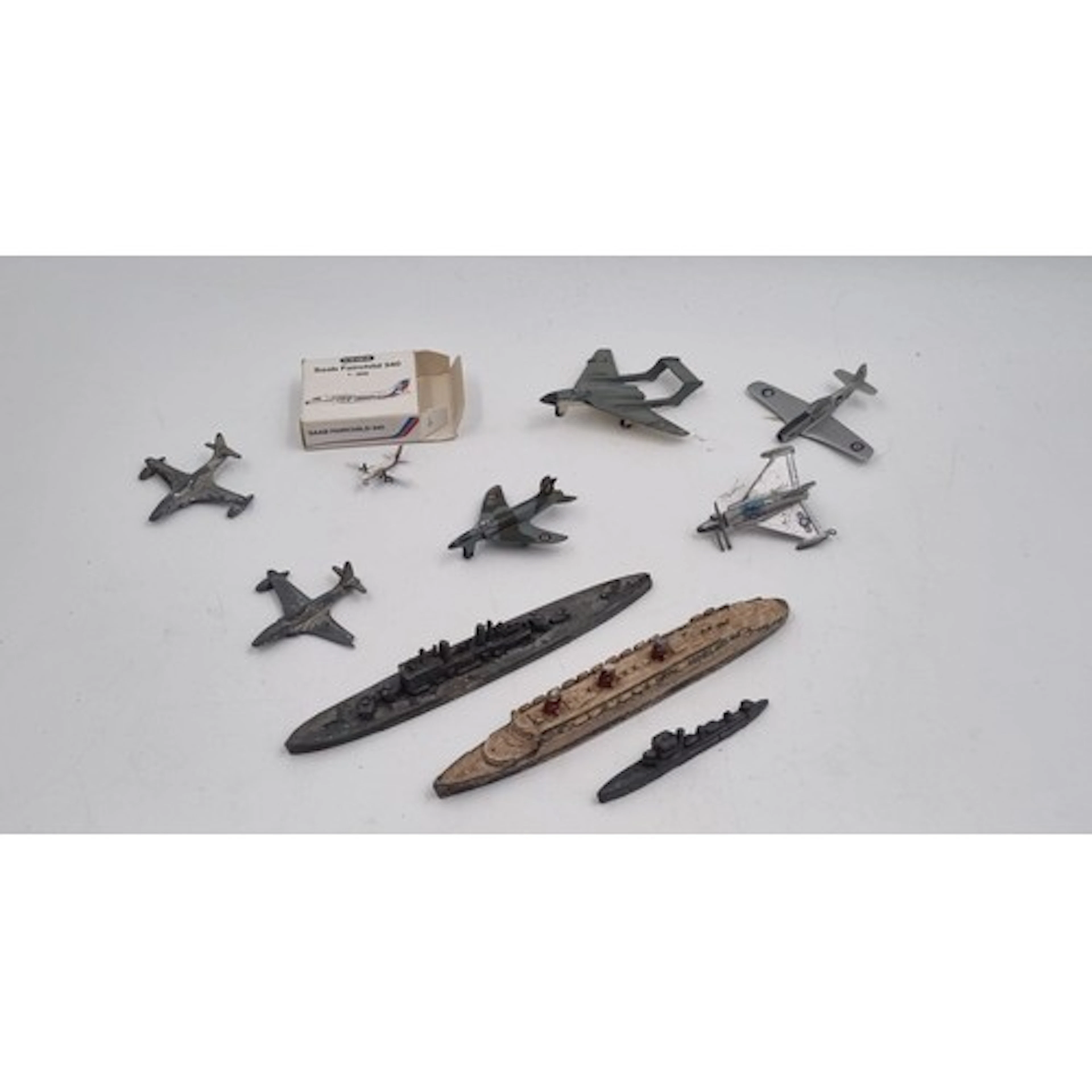 Assorted miniature aircraft and ship models, including Schab...